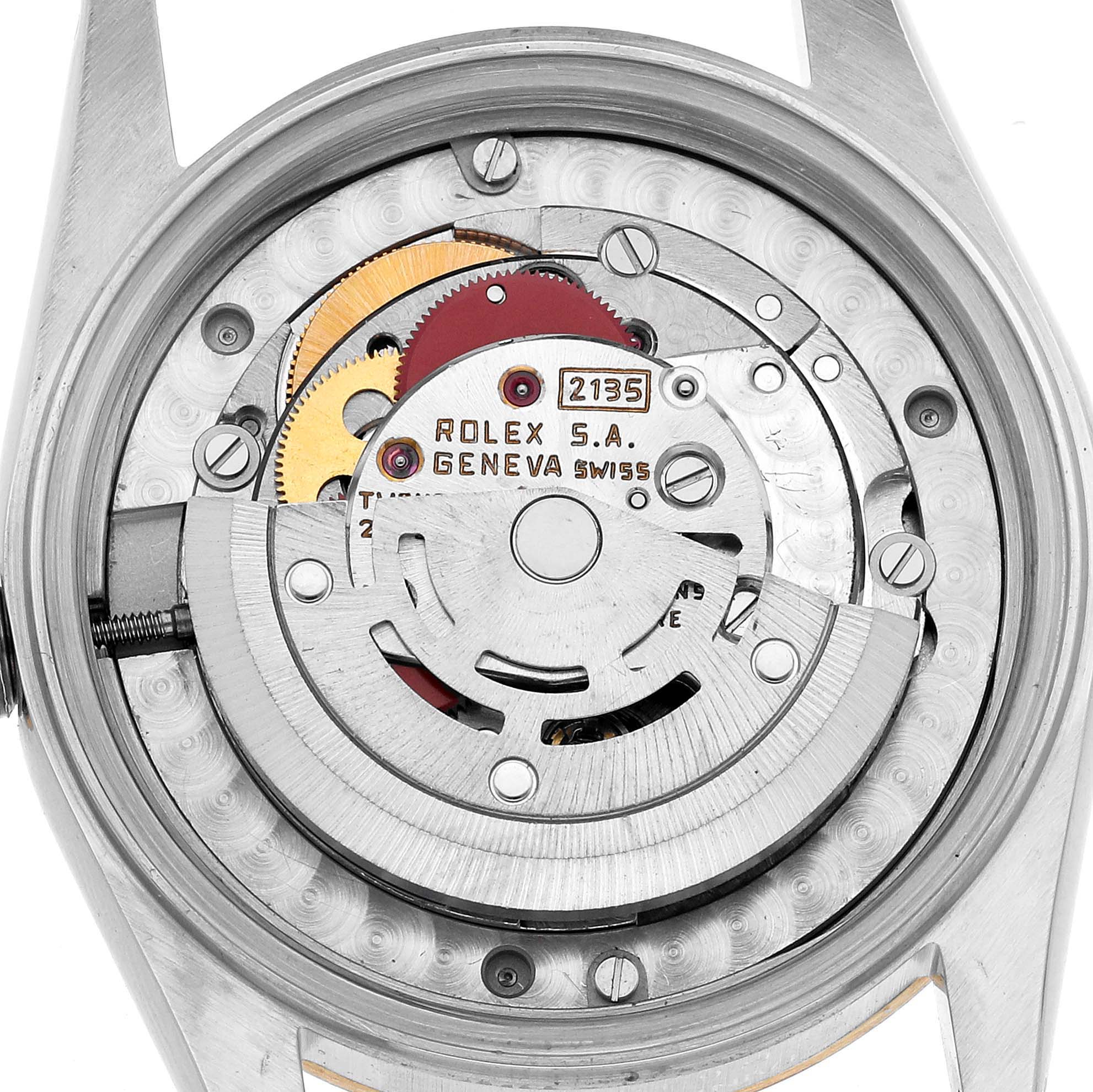 The image shows the back view of a Rolex Mid-Size 68273 Women's Steel and Gold (two tone) White Dial model, highlighting the internal mechanism and rotor.