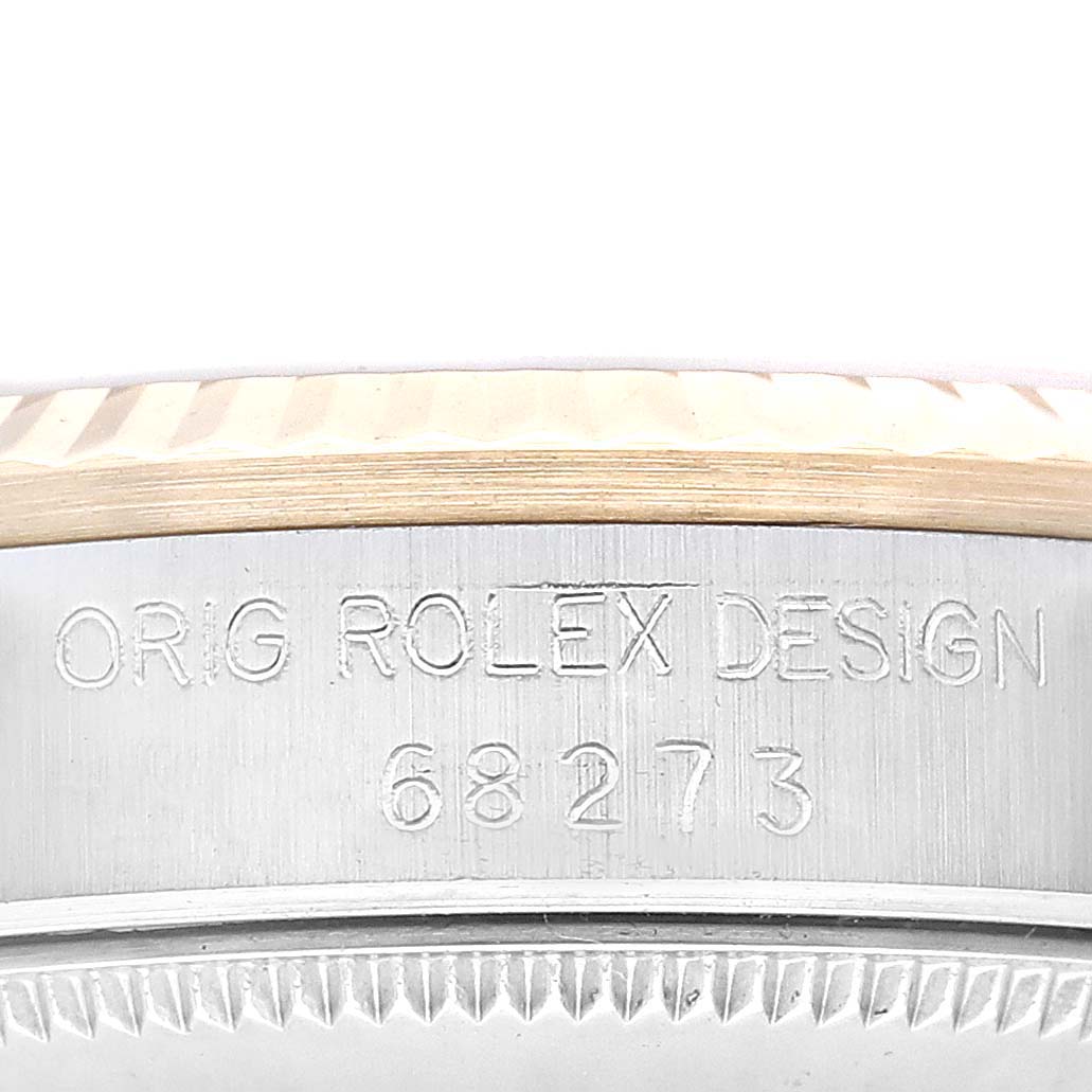 The image shows a close-up of the case side of a Mid-Size Rolex watch, displaying the engraving "ORIG ROLEX DESIGN 68273."