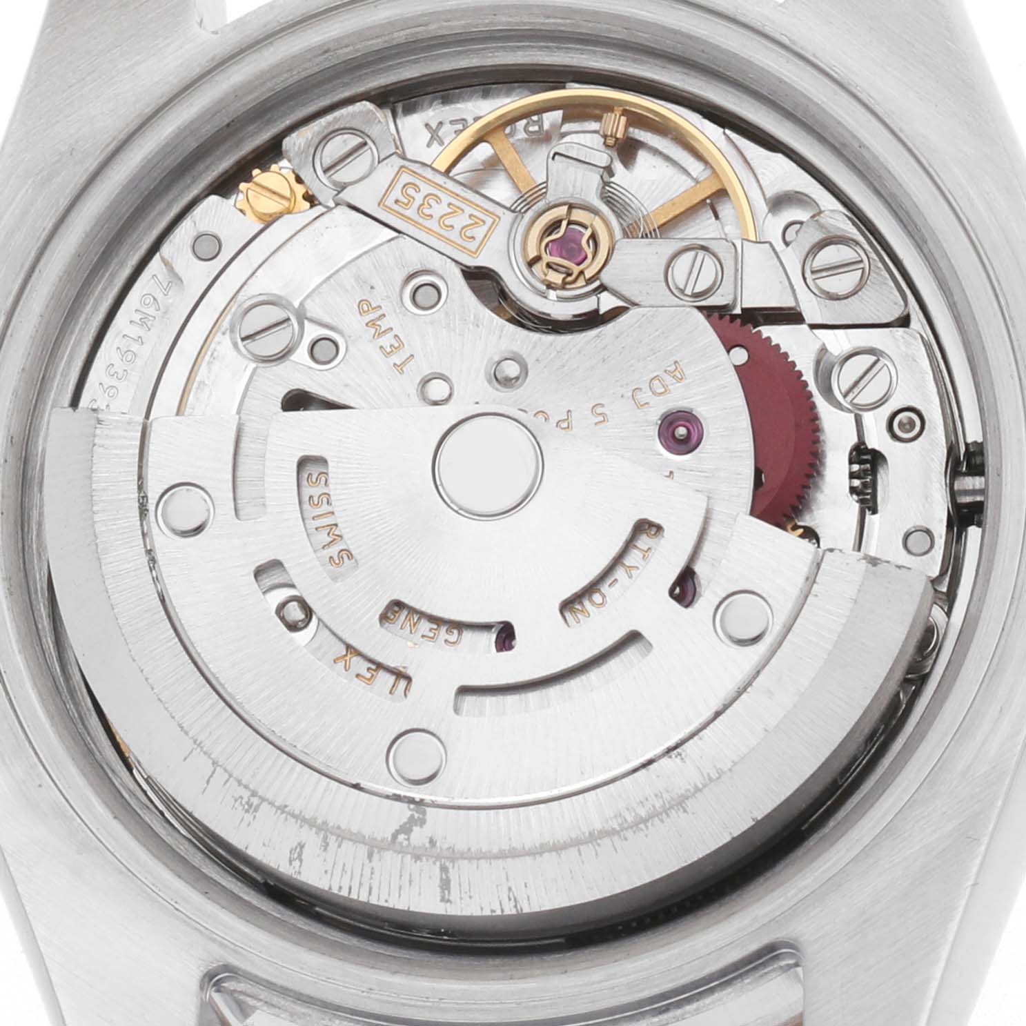 The image shows the movement of a Rolex Datejust 179171 Women's Steel and Gold (two tone) Mother of Pearl Dial watch from a top-down angle, highlighting gears and the rotor.
