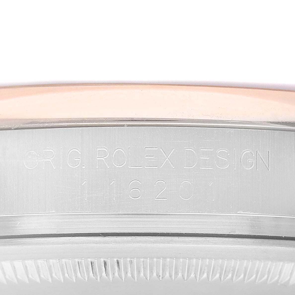 This image shows a close-up angle of the side of the case of a Rolex Datejust 116201 Men's Steel and Gold (two tone) White Dial 116201 Men's Steel and Gold (two tone) White Dial watch, featuring the engraved model and brand details.