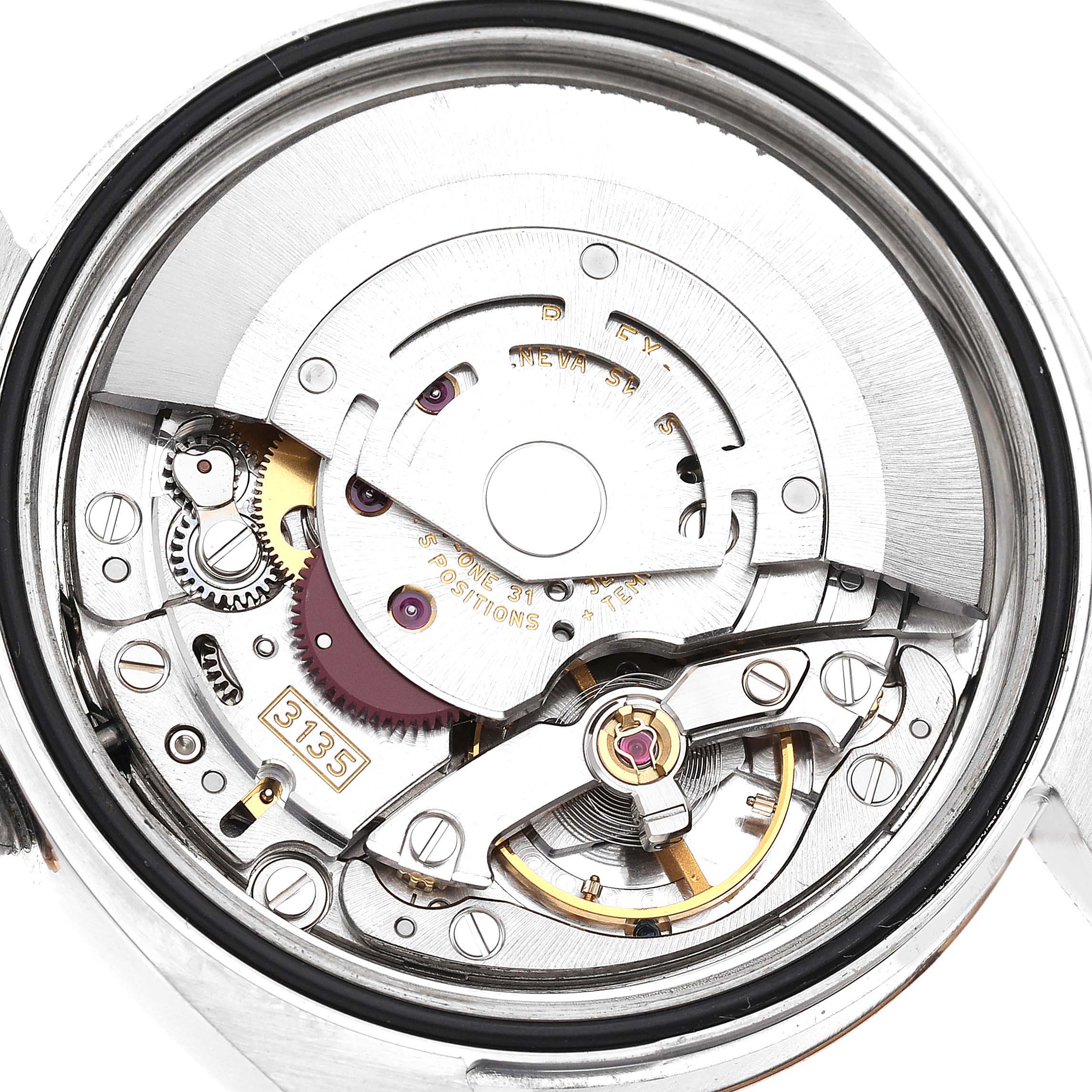 This image shows a close-up of the movement mechanism inside a Rolex Datejust 116201 Men's Steel and Gold (two tone) White Dial 116201 Men's Steel and Gold (two tone) White Dial watch.