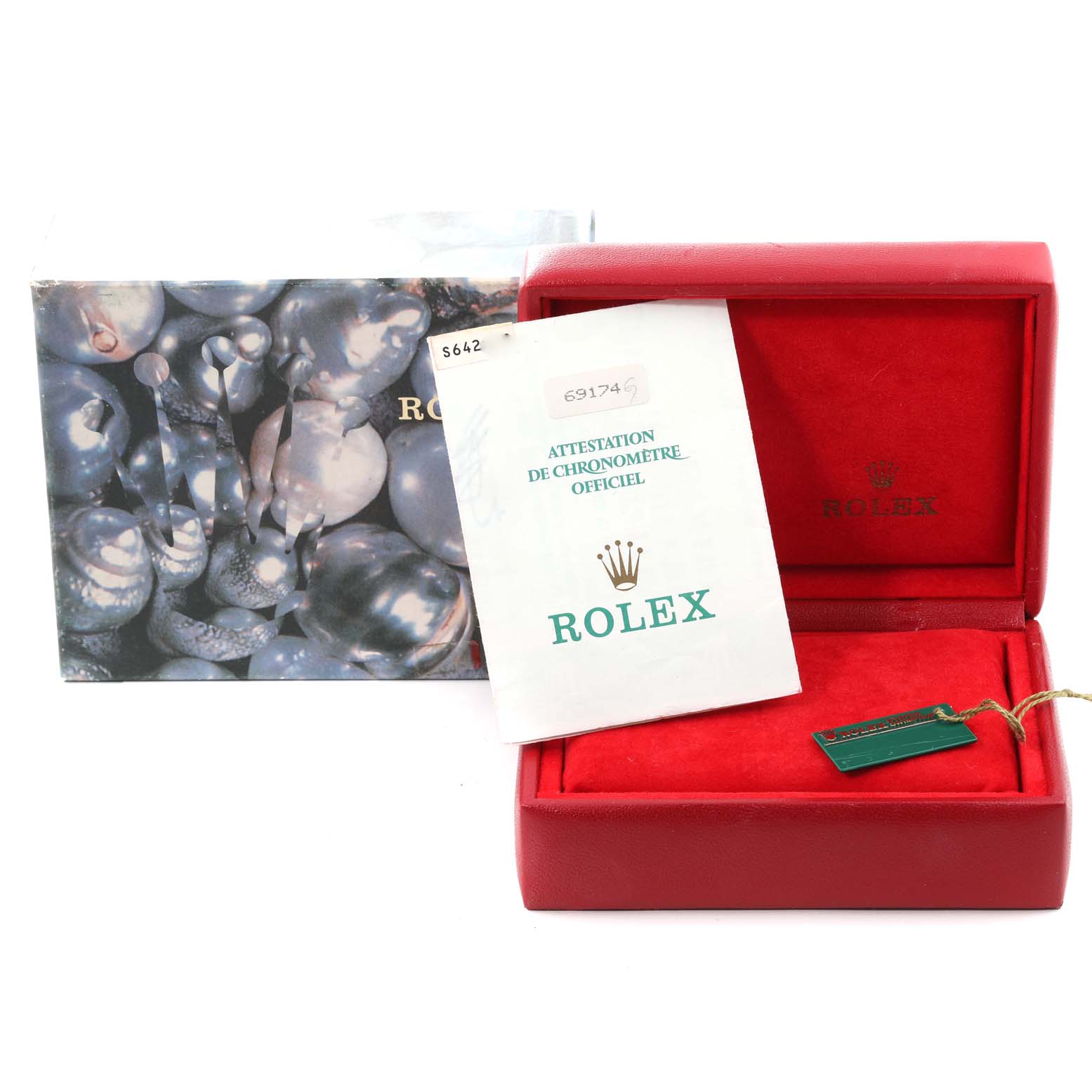The image shows the packaging, manual, and hangtag for a Rolex Datejust 69174 Women's Stainless Steel Silver Dial 69174 Women's Stainless Steel Silver Dial watch, not the watch itself.