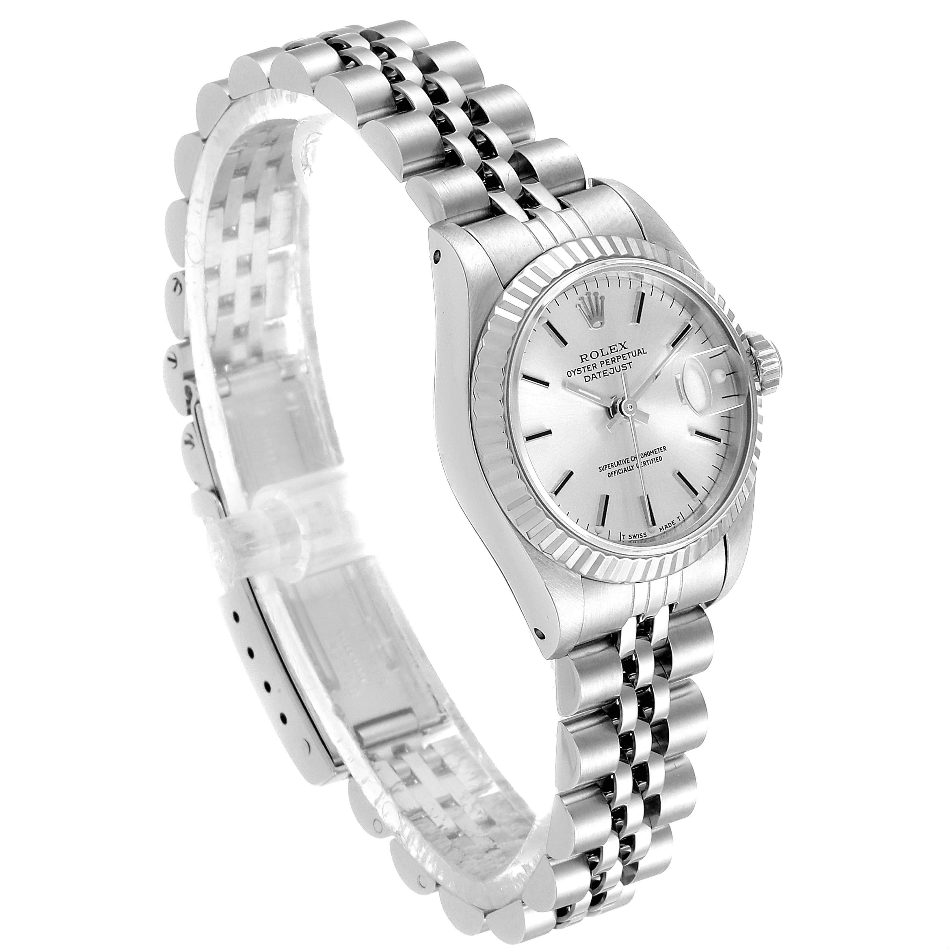 This image shows a Rolex Datejust 69174 Women's Stainless Steel Silver Dial 69174 Women's Stainless Steel Silver Dial watch at a three-quarters angle, highlighting its silver dial, fluted bezel, and Jubilee bracelet.