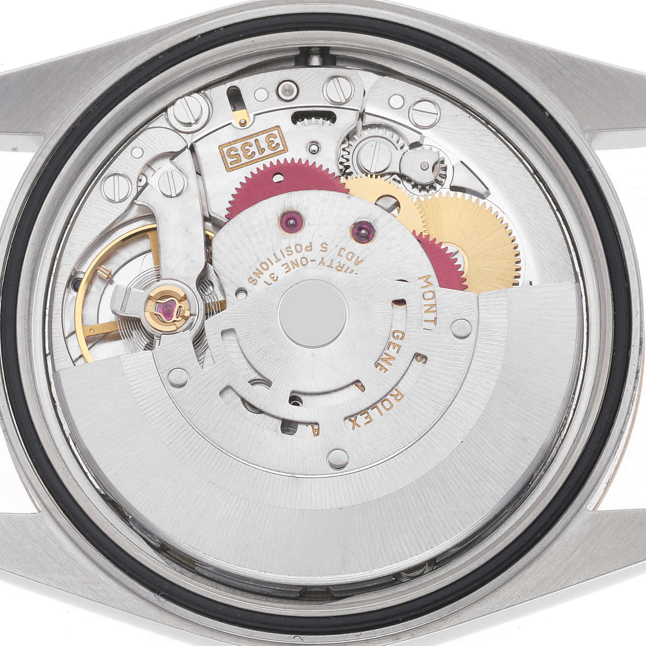 The image shows the movement mechanism of a Rolex Datejust 16233 Men's Steel and Gold (two tone) Champagne Dial watch from the back, revealing gears and components.