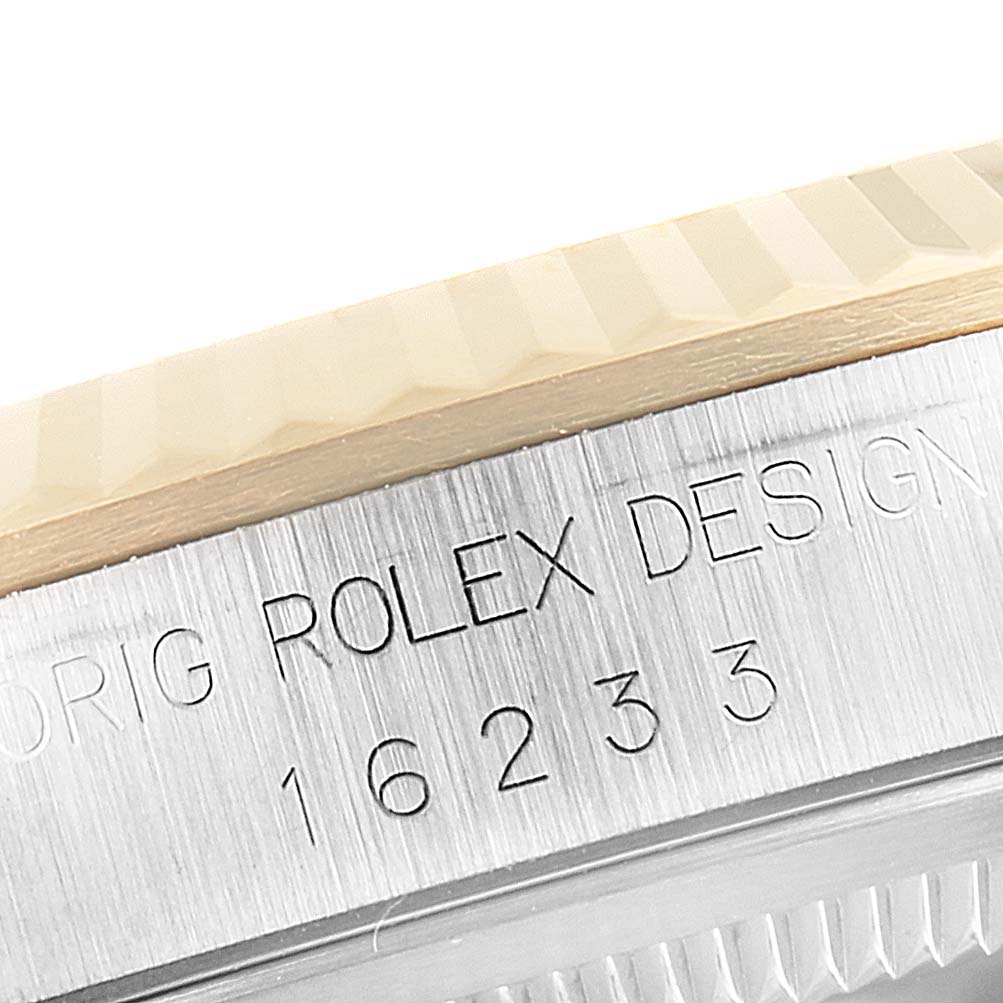 The image shows a close-up of the side of a Rolex Datejust 16233 Men's Steel and Gold (two tone) Champagne Dial 16233 Men's Steel and Gold (two tone) Champagne Dial watch, highlighting the model number and bezel.