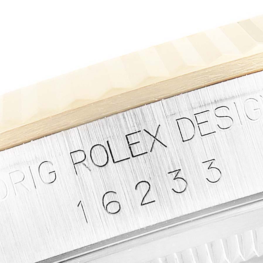 This image shows a close-up of the case side engraving on a Rolex Datejust 16233 Men's Steel and Gold (two tone) Silver Dial 16233 Men's Steel and Gold (two tone) Silver Dial model, displaying the model number "16233".