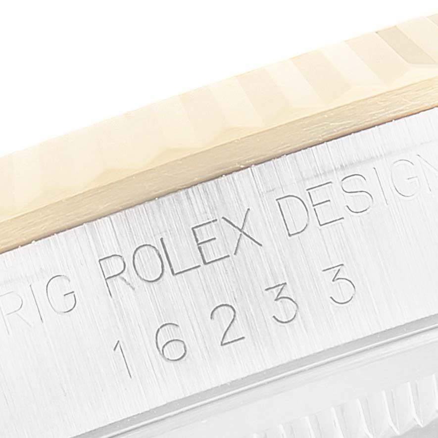 This image shows a close-up of the engraved model number "16233" on the case of a Rolex Datejust 16233 Men's Steel and Gold (two tone) Champagne Dial 16233 Men's Steel and Gold (two tone) Champagne Dial watch.