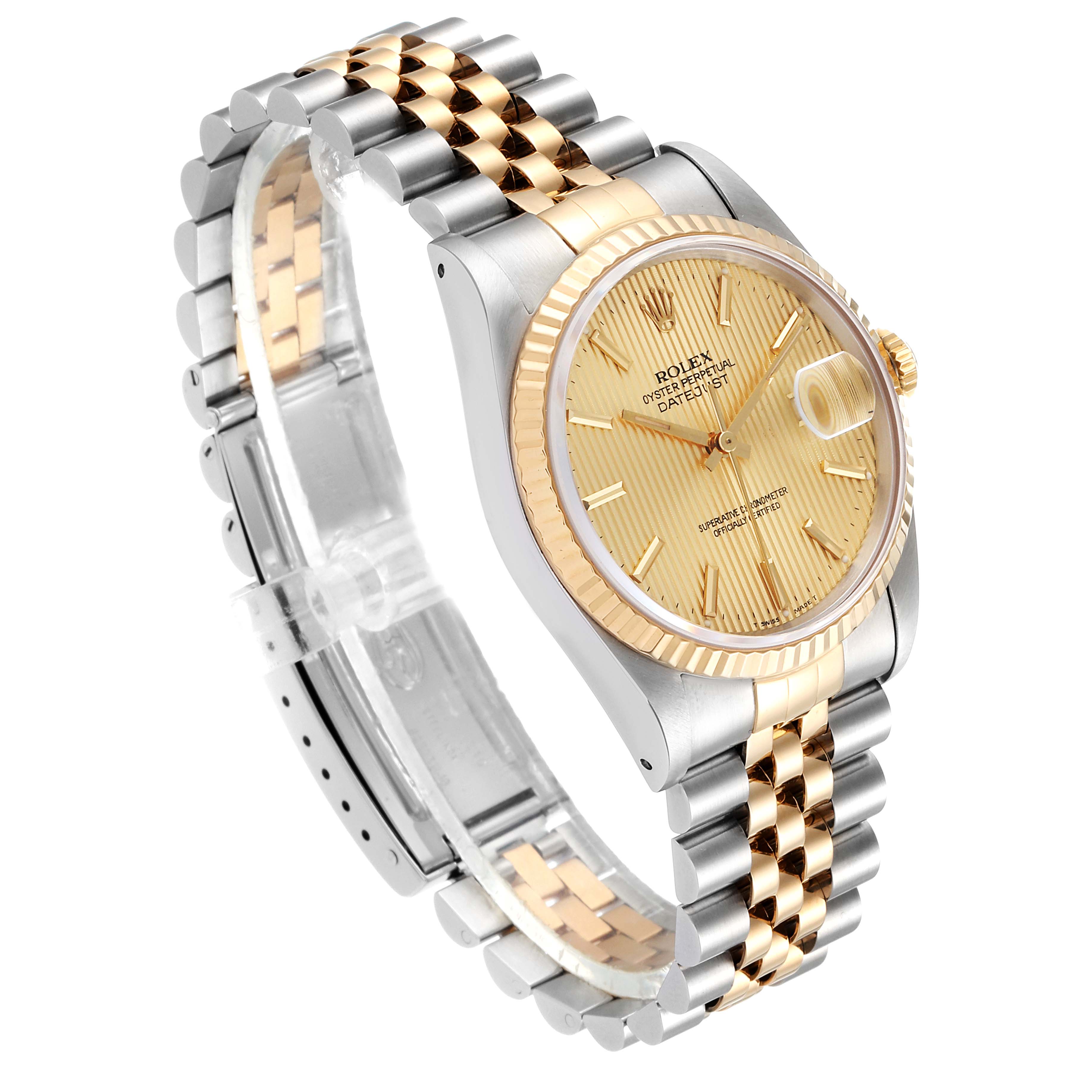 The Rolex Datejust 16233 Men's Steel and Gold (two tone) Champagne Dial 16233 Men's Steel and Gold (two tone) Champagne Dial watch is shown at a three-quarter angle, highlighting its gold dial, fluted bezel, and two-tone bracelet.