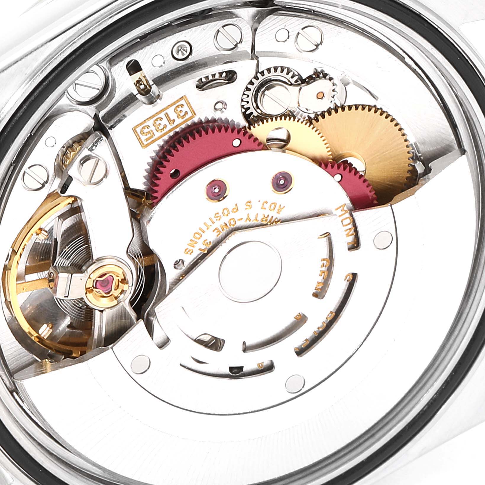 This image shows a close-up view of the internal mechanics of a Rolex Datejust 16233 Men's Steel and Gold (two tone) Blue Dial 16233 Men's Steel and Gold (two tone) Blue Dial watch, highlighting gears and movement parts.