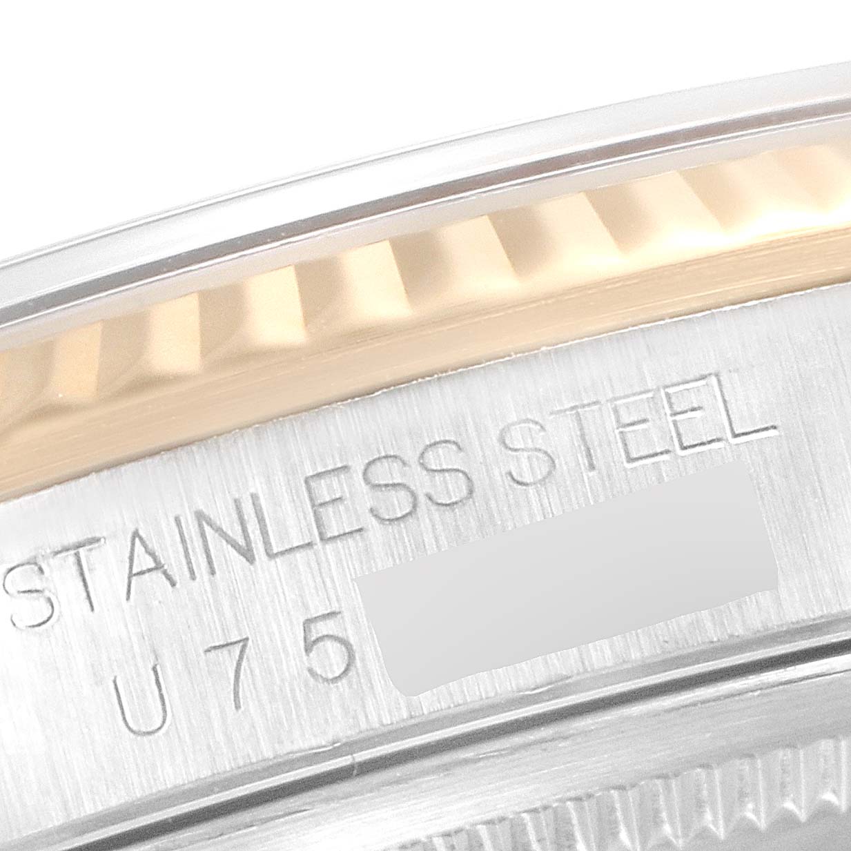 This image shows a close-up of the Rolex Datejust 16233 Men's Steel and Gold (two tone) Blue Dial 16233 Men's Steel and Gold (two tone) Blue Dial model, highlighting the bezel and part of the case marked "STAINLESS STEEL."