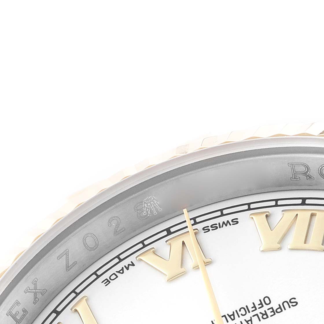 The image shows a close-up of the Rolex Datejust 116233 Men's Steel and Gold (two tone) White Dial dial, featuring the edge with embossed branding and Roman numerals.