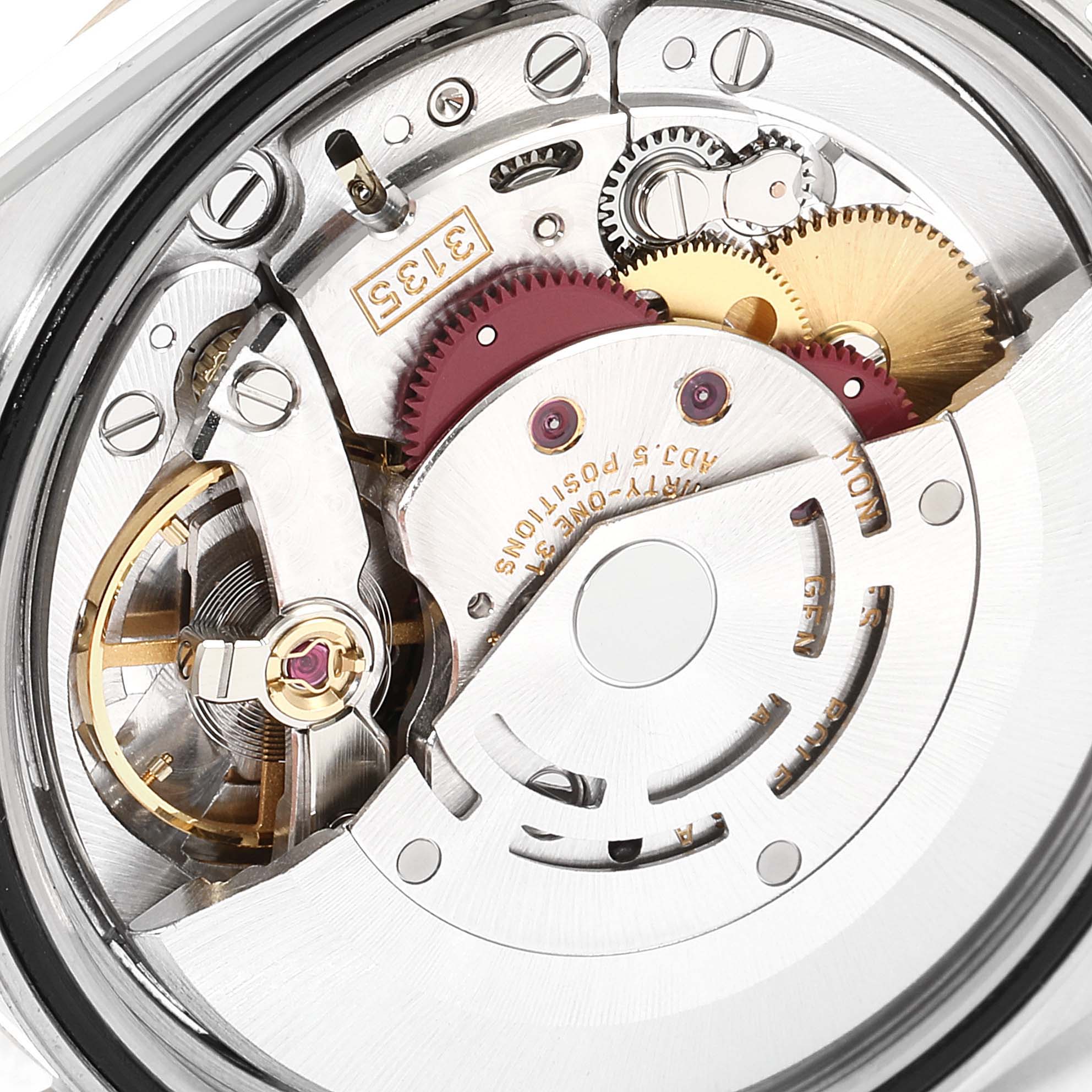 This image shows the intricate movement parts of a Rolex Datejust 16233 Men's Steel and Gold (two tone) White Dial 16233 Men's Steel and Gold (two tone) White Dial watch, viewed from a close-up angle.