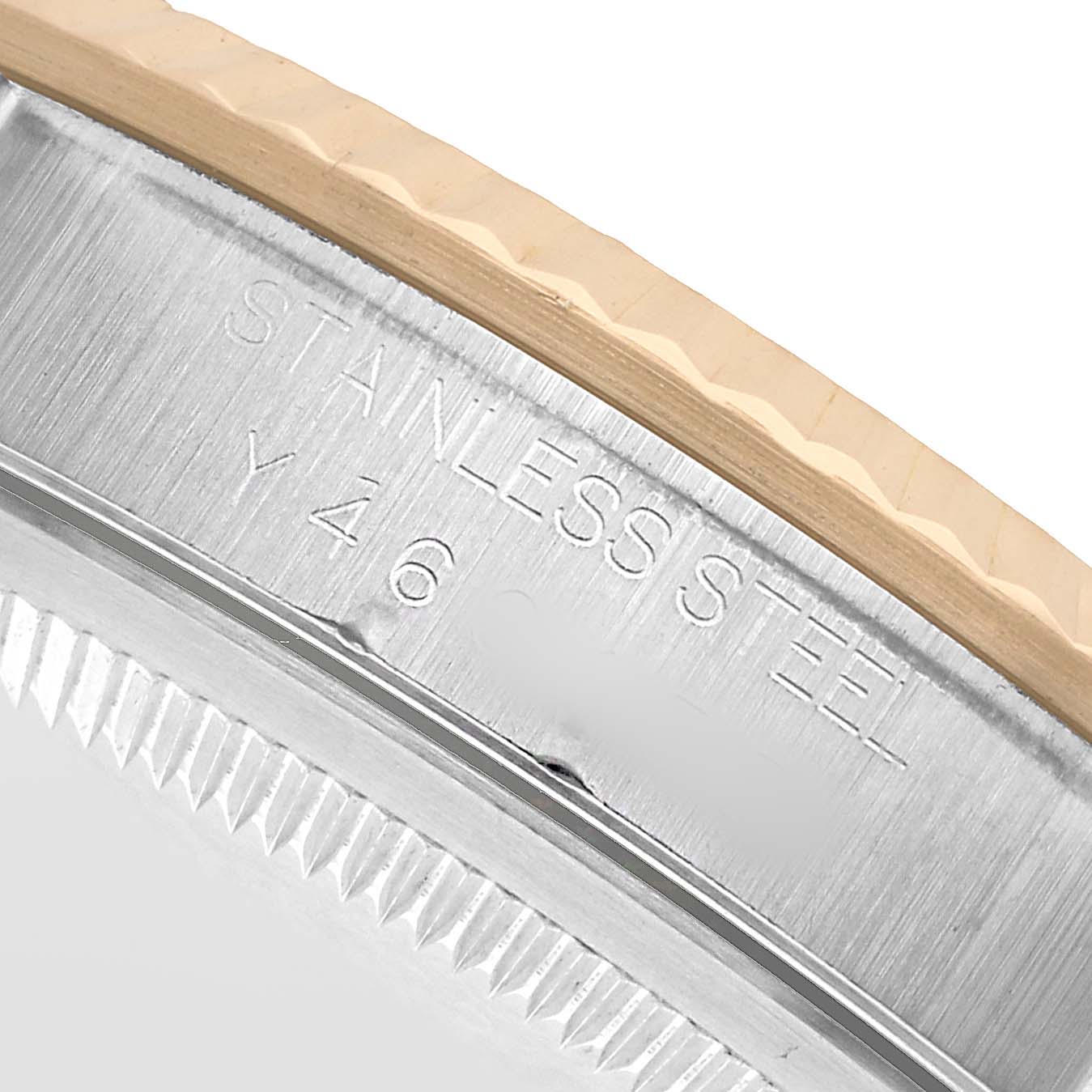 The image shows a close-up of the Rolex Datejust 16233 Men's Steel and Gold (two tone) White Dial's stainless steel case, focusing on the side with engravings.