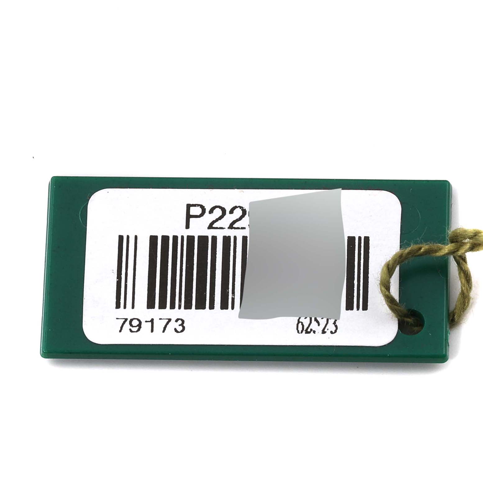 This is a close-up of a green tag with a barcode for a Rolex Datejust 79173 Women's Steel and Gold (two tone) White Dial 79173 Women's Steel and Gold (two tone) White Dial watch.
