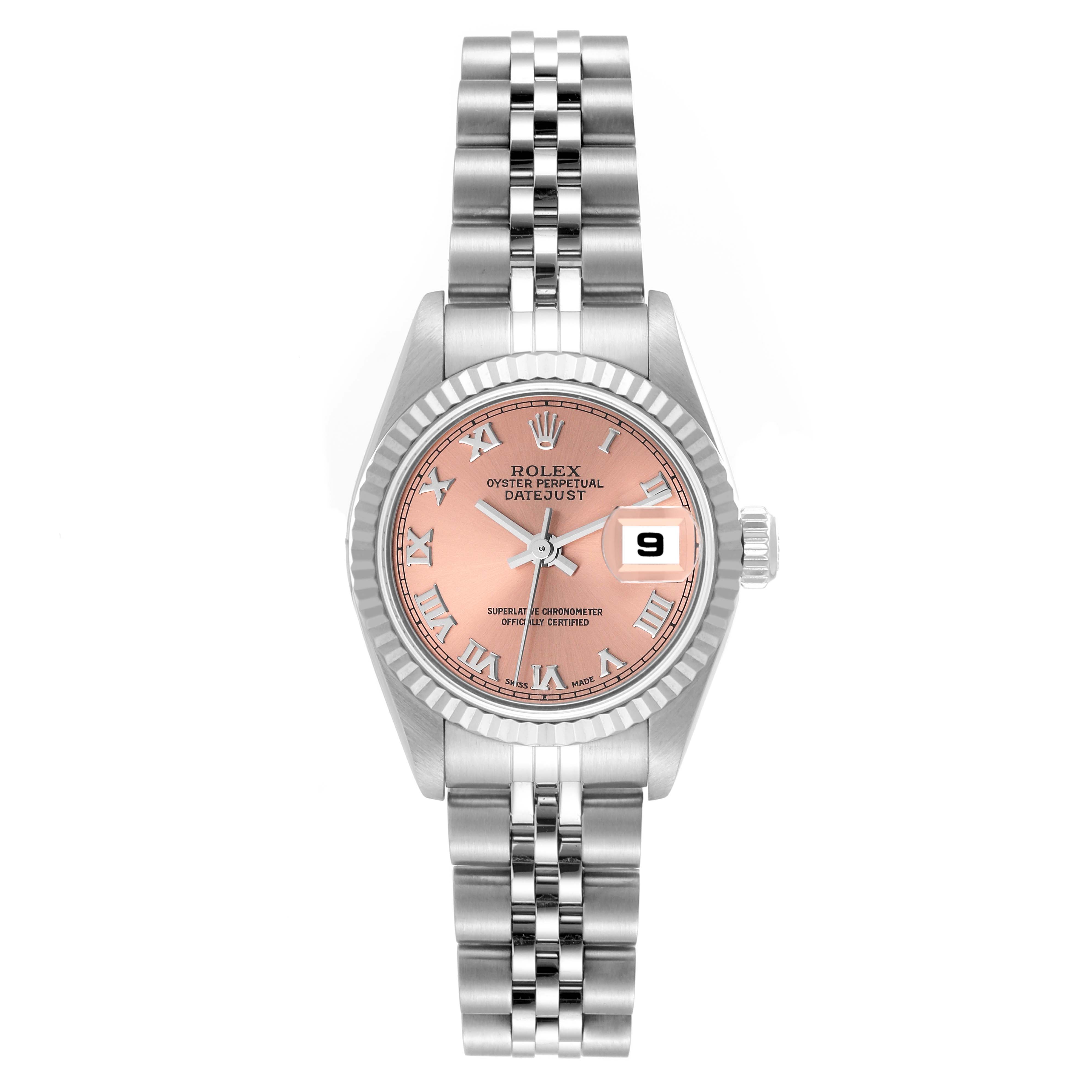 The image shows a front view of a Rolex Datejust 79174 Women's Stainless Steel Pink Dial 79174 Women's Stainless Steel Pink Dial watch with a pink dial, Roman numerals, fluted bezel, and jubilee bracelet.