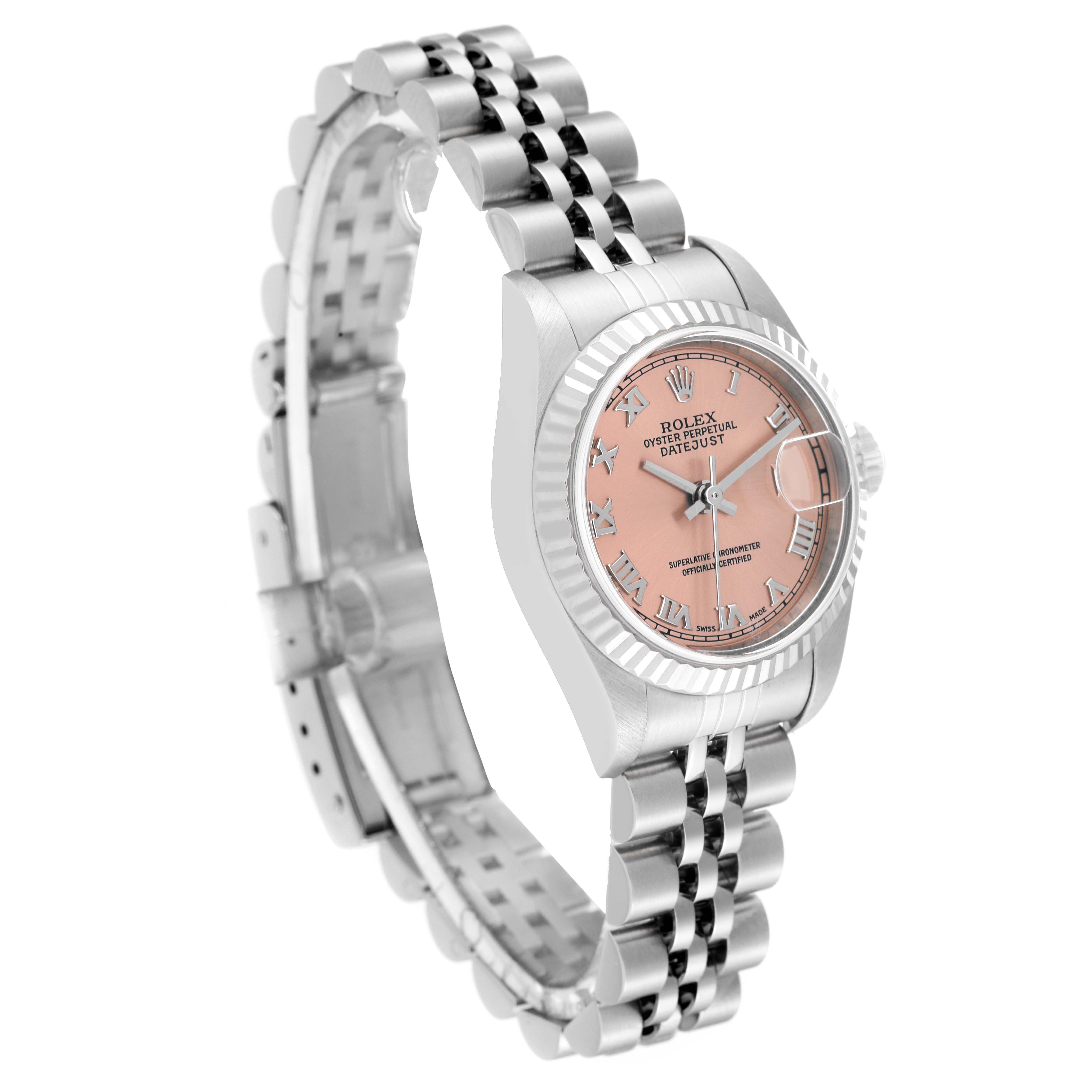 The Rolex Datejust 79174 Women's Stainless Steel Pink Dial 79174 Women's Stainless Steel Pink Dial watch is shown at a three-quarter angle, displaying the face, fluted bezel, and jubilee bracelet.