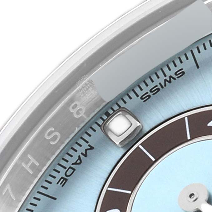 This image shows a close-up of the dial and bezel of a Rolex Daytona 116506 Men's Platinum Blue Dial 116506 Men's Platinum Blue Dial watch, highlighting the "SWISS MADE" text and part of the hour markers.