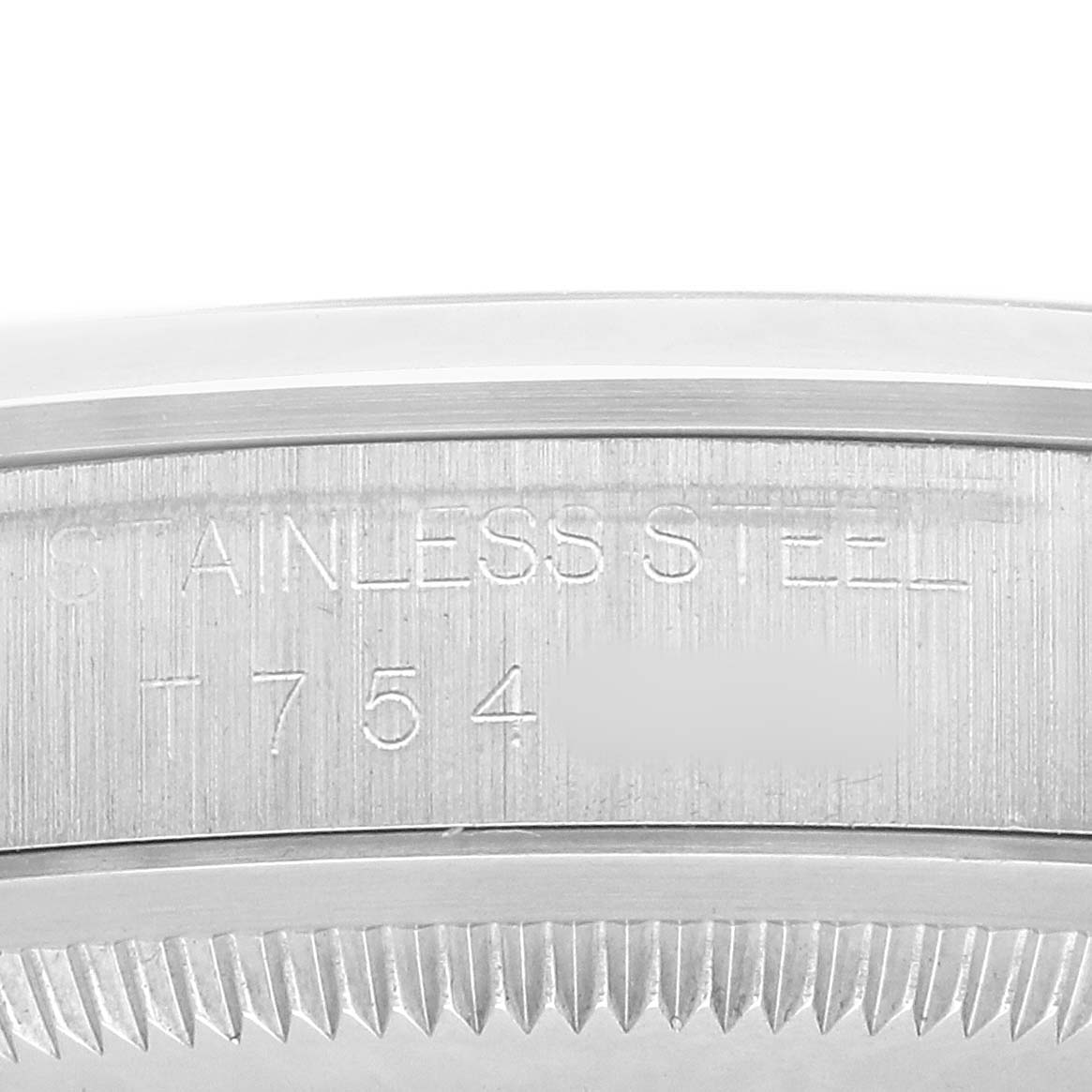 The image shows the side view of a Rolex Explorer 14270 Men's Stainless Steel Black Dial watch case, highlighting the engraved text on its stainless steel surface.