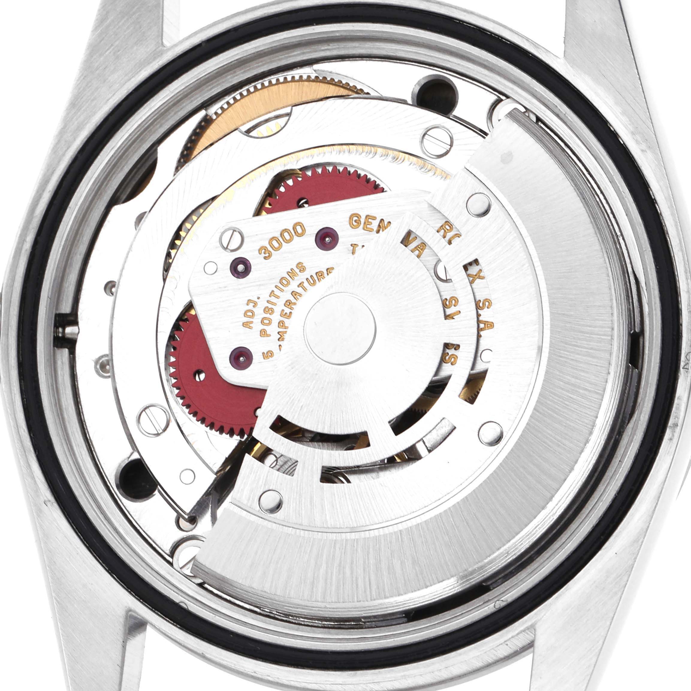 The image shows the back view of a Rolex Explorer 14270 Men's Stainless Steel Black Dial watch, focusing on its internal mechanical movement components.