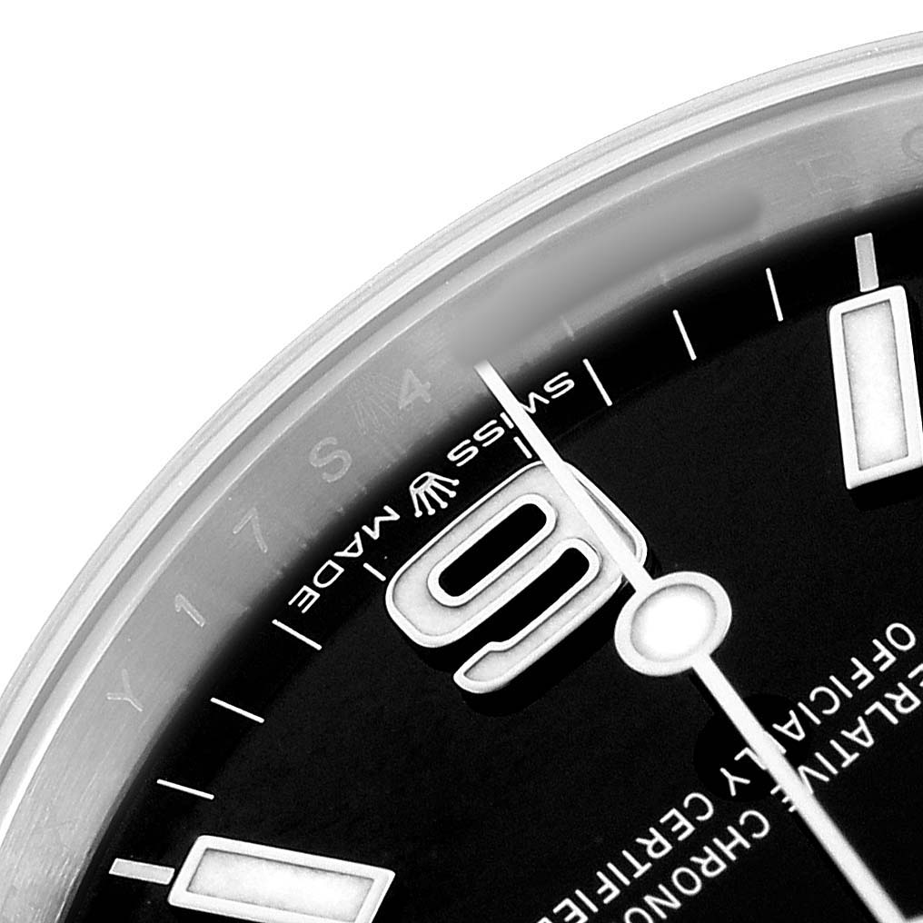 The image shows a close-up of the dial of a Rolex Explorer 224270 Men's Stainless Steel Black Dial, highlighting the "6" marker, hands, and "Swiss Made" text.