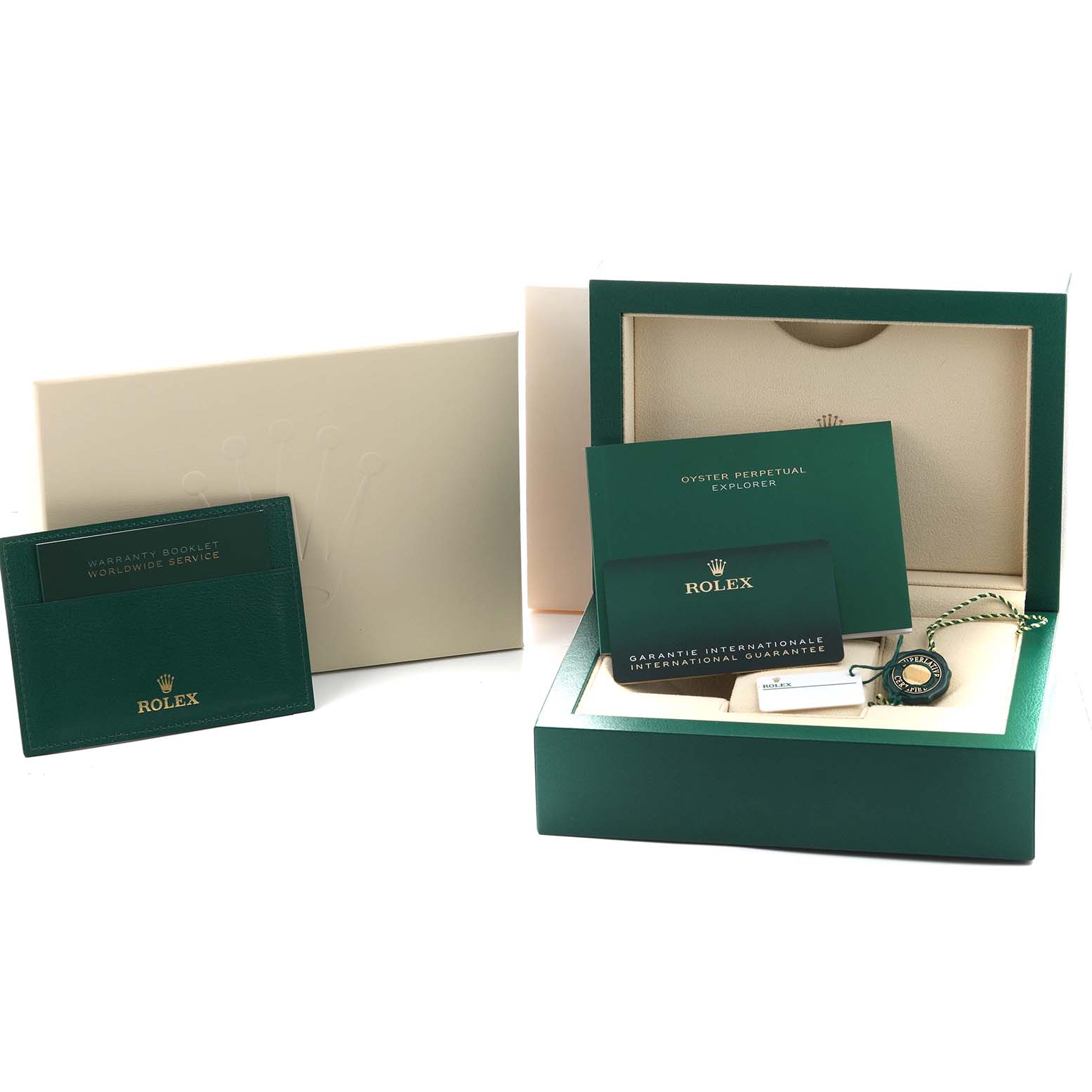The image shows a Rolex Explorer 224270 Men's Stainless Steel Black Dial box with warranty cards, a booklet, and a hangtag, all at a slightly elevated angle.