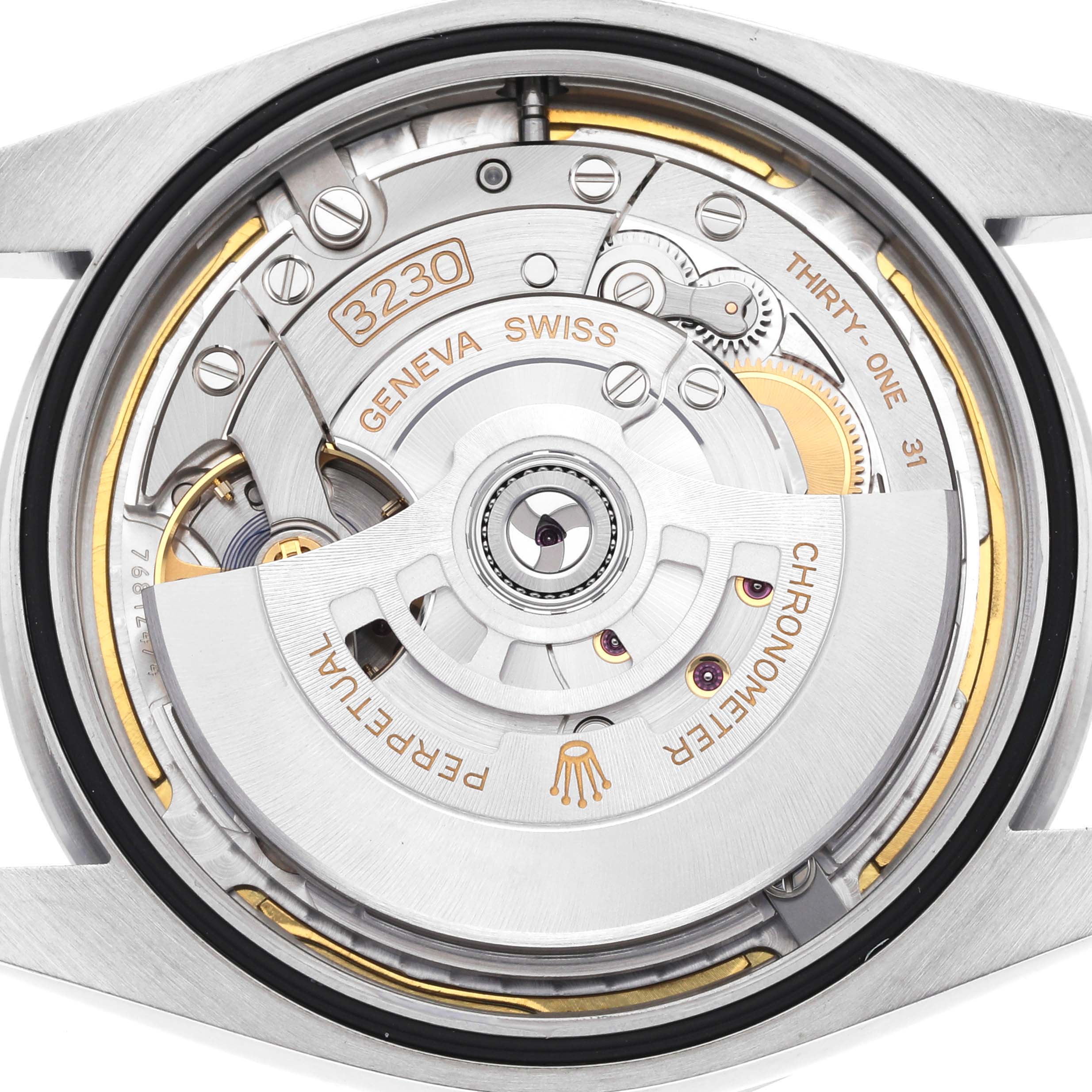 The image shows the movement of a Rolex Explorer 224270 Men's Stainless Steel Black Dial watch from a rear angle, highlighting the rotor and internal mechanisms.