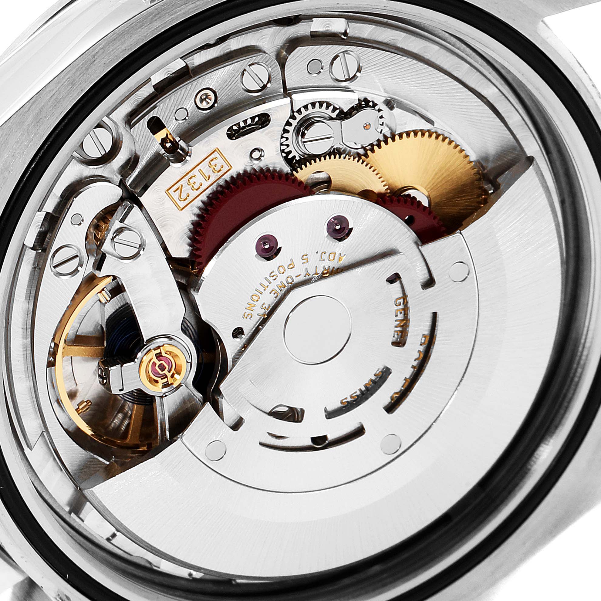 The image shows a close-up of the internal mechanical movement of a Rolex Explorer 214270 Men
s Stainless Steel Black Dial 214270 Men
s Stainless Steel Black Dial watch.