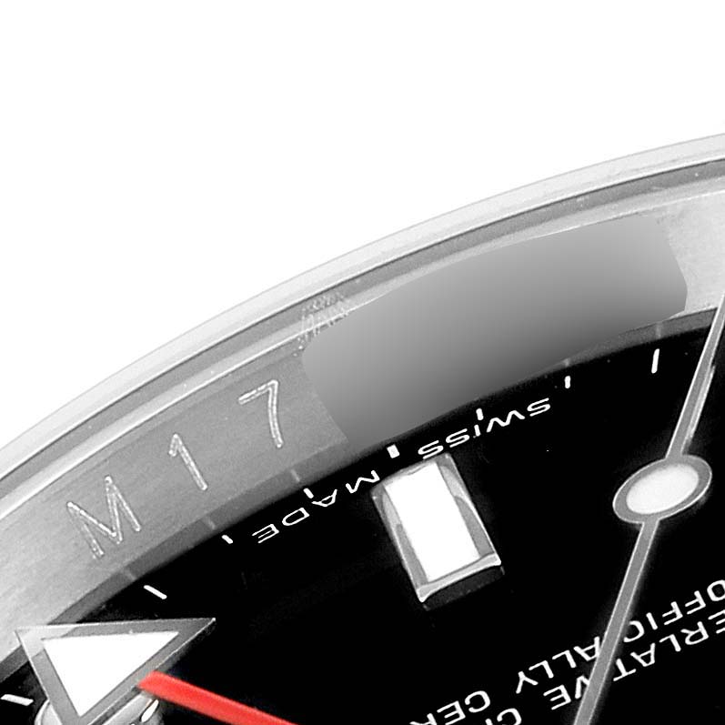 The image shows a close-up of a Rolex Explorer 16570 Men
s Stainless Steel Black Dial 16570 Men
s Stainless Steel Black Dial watch, focusing on the edge of the dial and bezel near the 2 o
clock position.