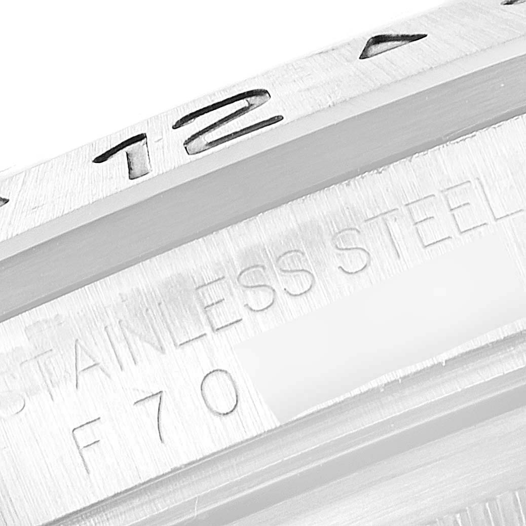 This image shows a close-up of the stainless steel bezel and engraved details on a Rolex Explorer 16570 Men
s Stainless Steel White Dial 16570 Men
s Stainless Steel White Dial watch.