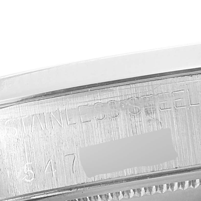 The image shows a close-up of the stainless steel casing with engraved text of a Rolex Vintage Collection 6694 Men
s Stainless Steel Black Dial 6694 Men
s Stainless Steel Black Dial watch.