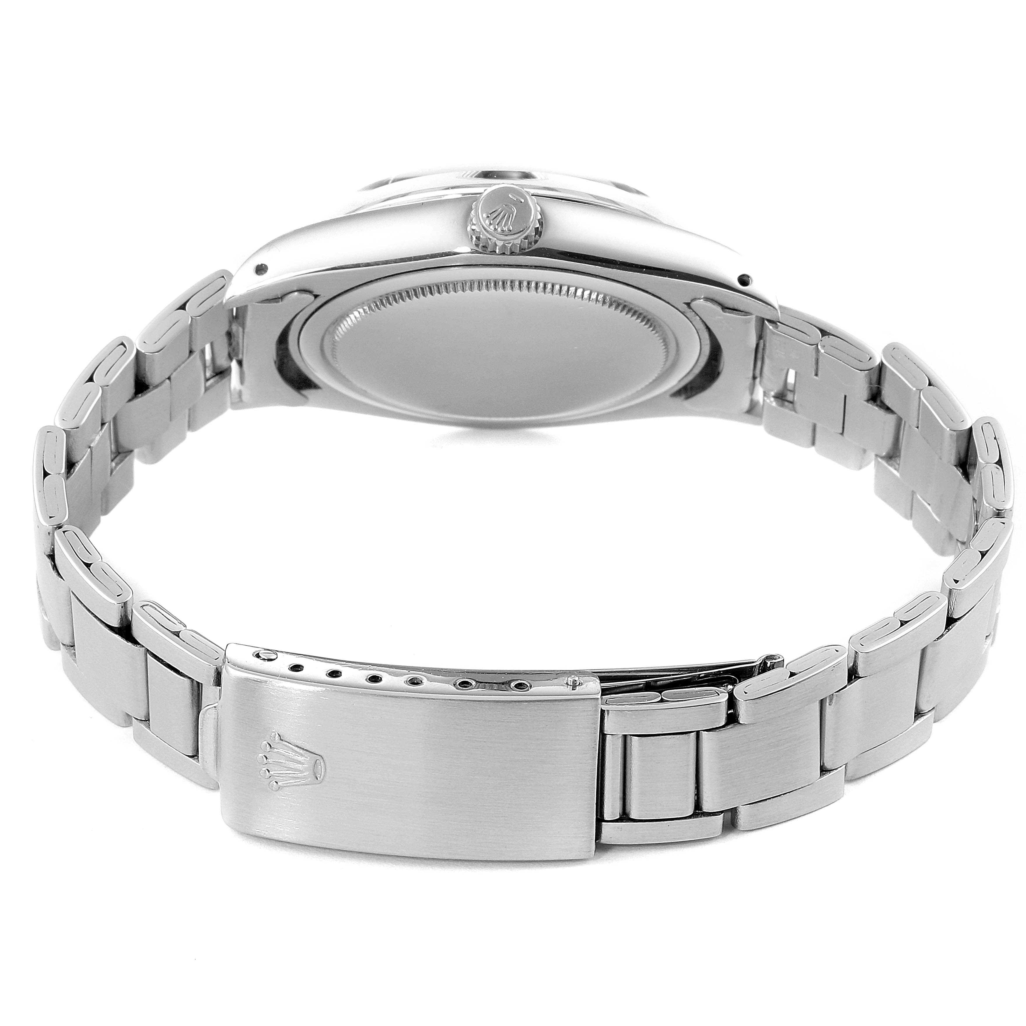 The image shows the back view and strap of a Rolex Vintage Collection 6694 Men
s Stainless Steel Black Dial 6694 Men
s Stainless Steel Black Dial model, emphasizing the clasp and case back.