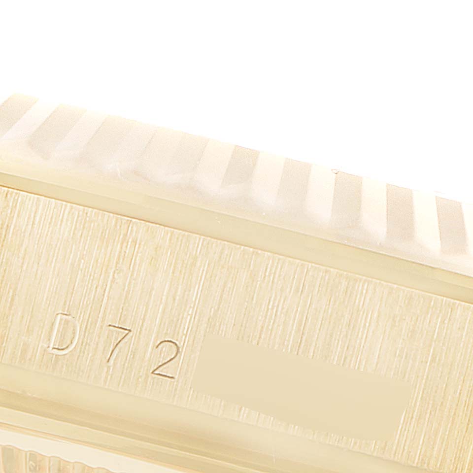 The image shows a close-up of the side of a Rolex President 118238 Men
s Yellow Gold White Dial 118238 Men
s Yellow Gold White Dial model, featuring part of the case and a portion of the bezel.