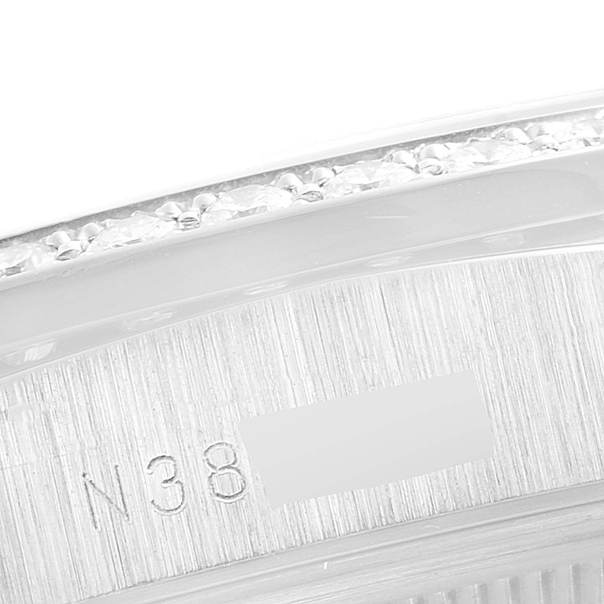 This image is a close-up of the bezel and case of a Rolex President 18346 Men's Platinum Silver Dial 18346 Men's Platinum Silver Dial model watch.