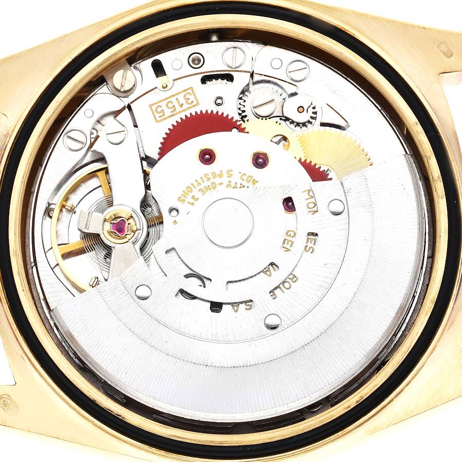 This image shows the movement of a Rolex President 18238 Men's Yellow Gold Champagne Dial model, viewed from the back with visible gears and components.