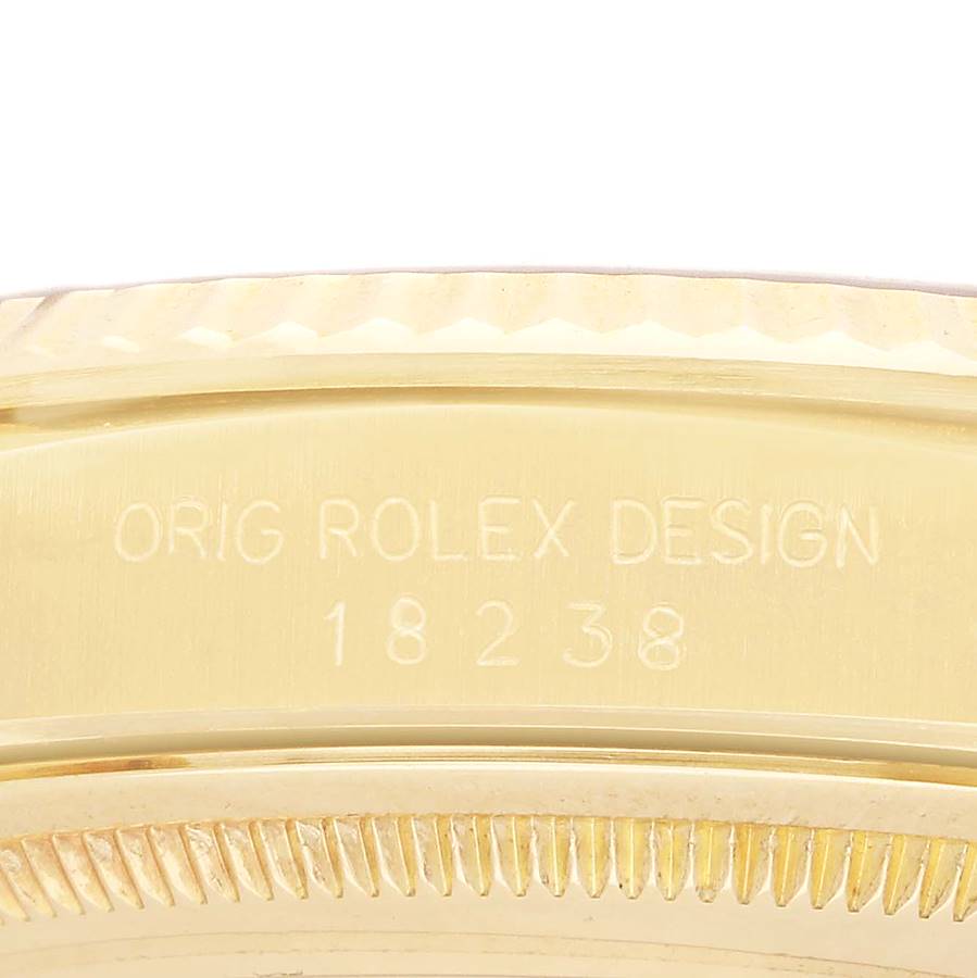 The image shows a close-up of the model number and details on the side of a Rolex President 18238 Men's Yellow Gold Champagne Dial watch.