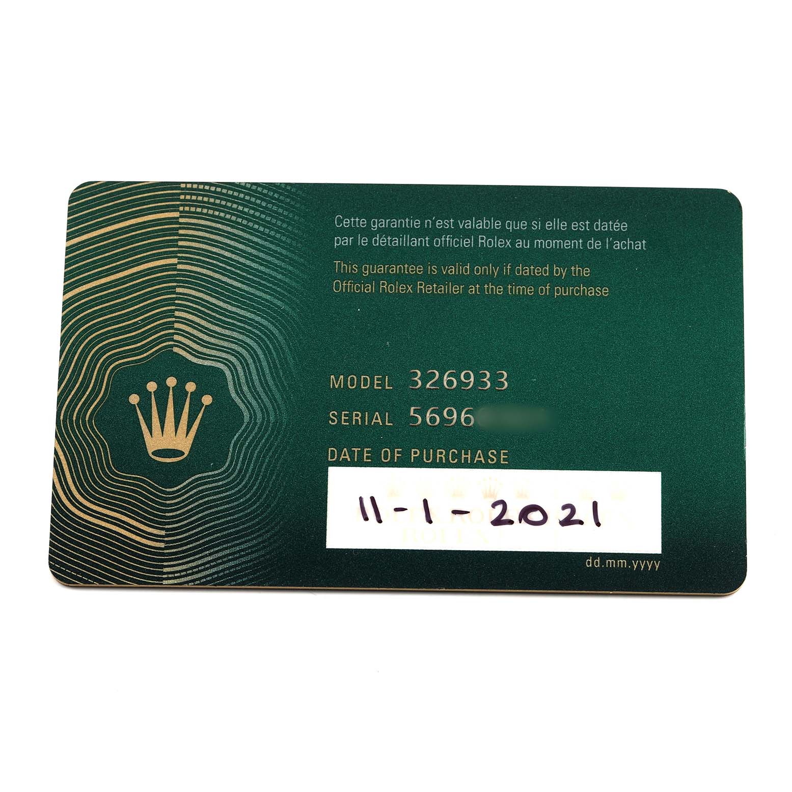 The image shows a Rolex warranty card for the Sky-Dweller model, displaying model and serial numbers.