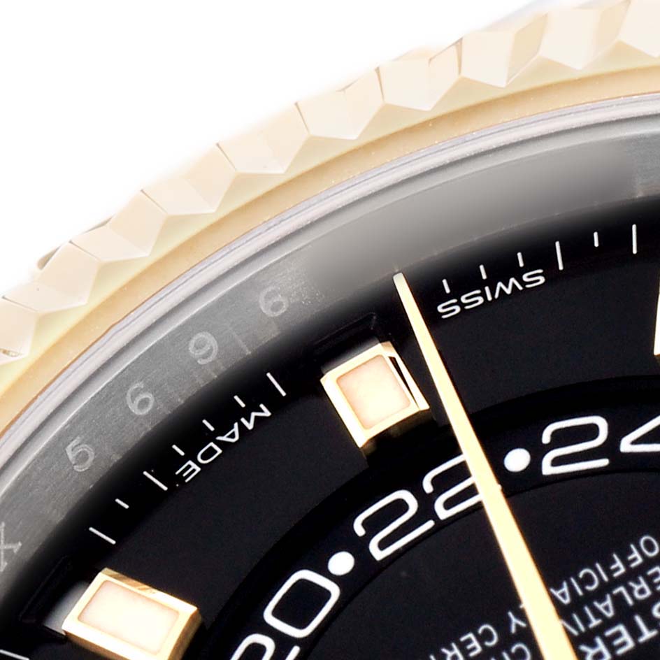 The image shows a close-up of the bezel and partial dial of the Rolex Sky-Dweller 326933 Men's Steel and Gold (two tone) Black Dial, highlighting the engraved numbers.