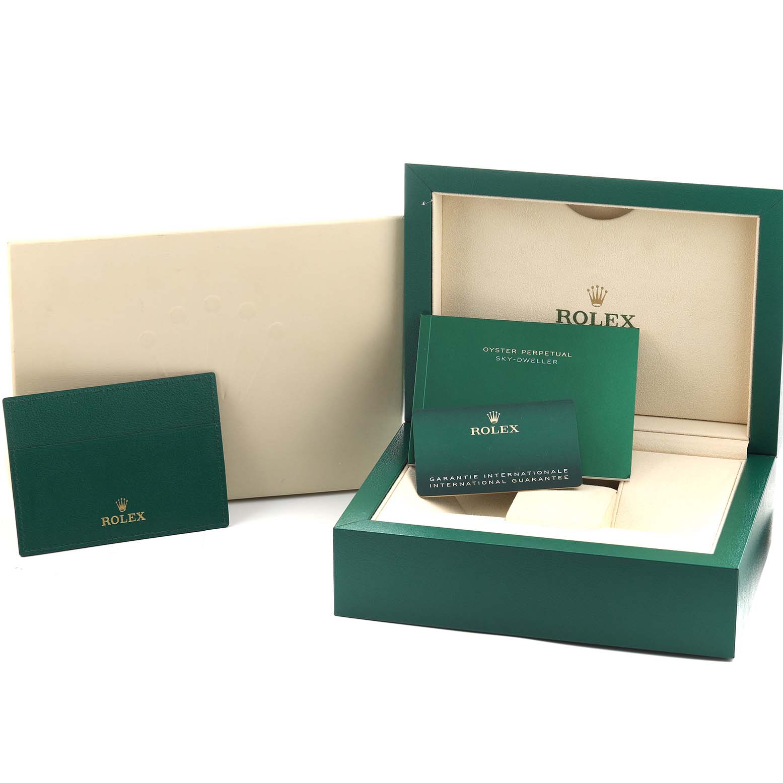 The image shows the Rolex Sky-Dweller 326933 Men's Steel and Gold (two tone) Black Dial packaging with a green box, warranty cards, and booklet, viewed from the front.