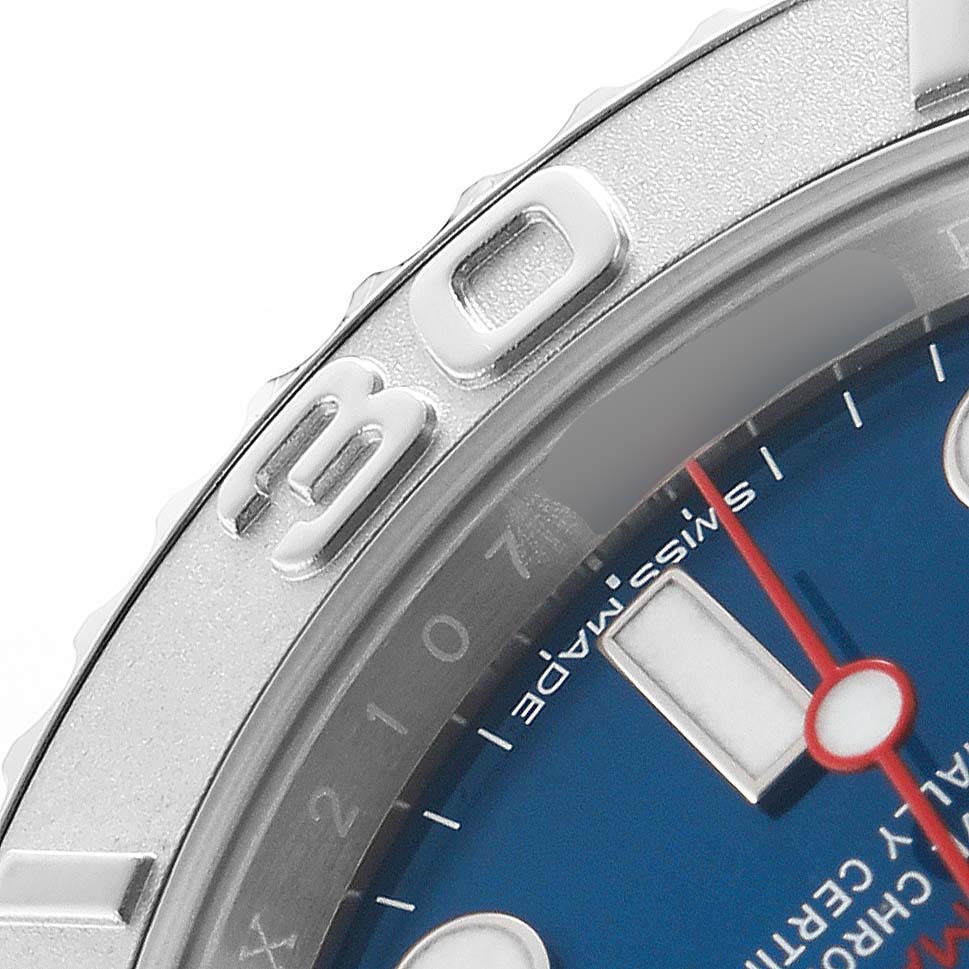 The image shows a close-up of the Rolex Yacht-Master 116622 Men's Stainless Steel Blue Dial's bezel, dial, and markers from an angled top-down view.