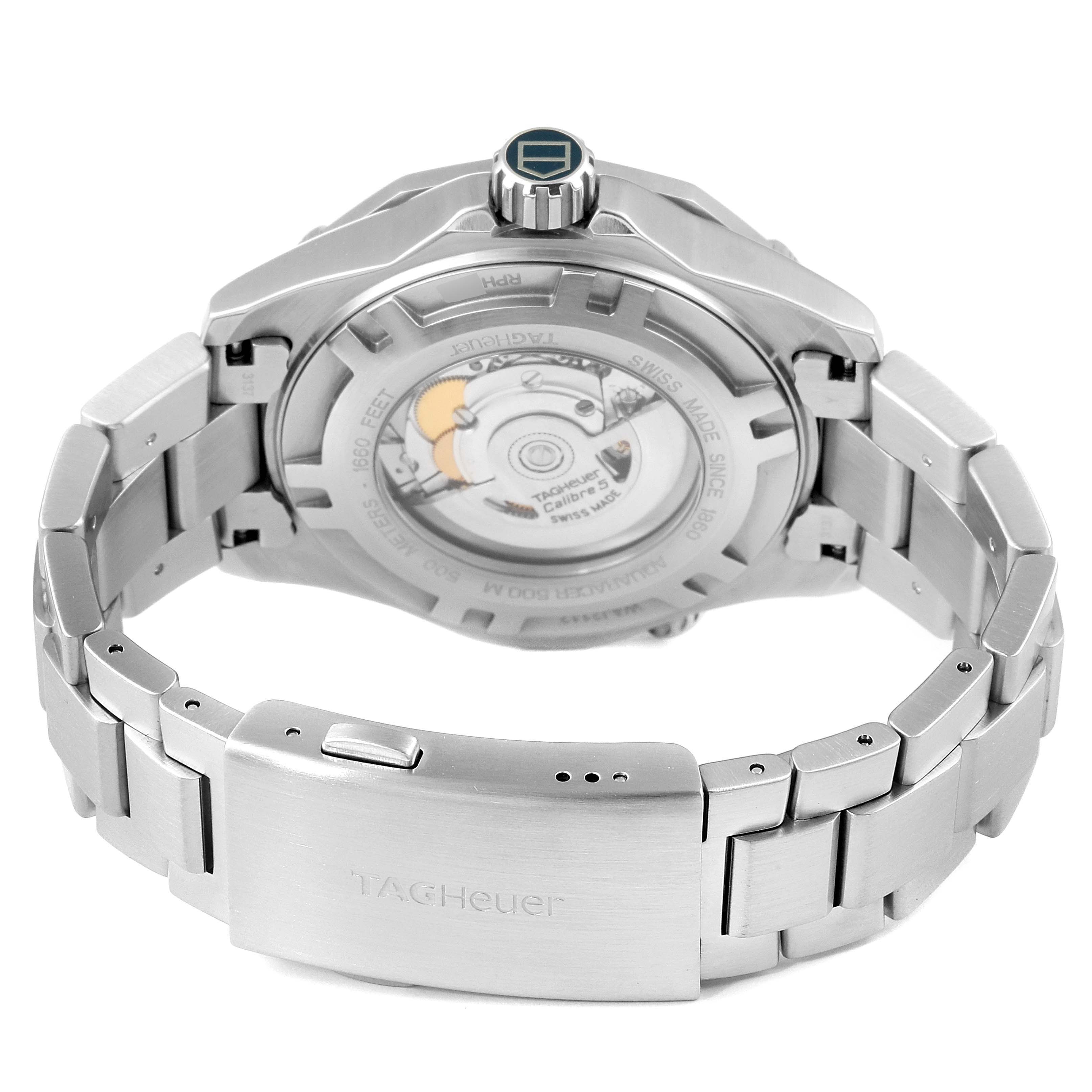 The image shows the back view of a Tag Heuer Aquaracer WAJ2112  Men
s Stainless Steel Blue Dial WAJ2112  Men
s Stainless Steel Blue Dial, highlighting the movement and stainless steel bracelet.