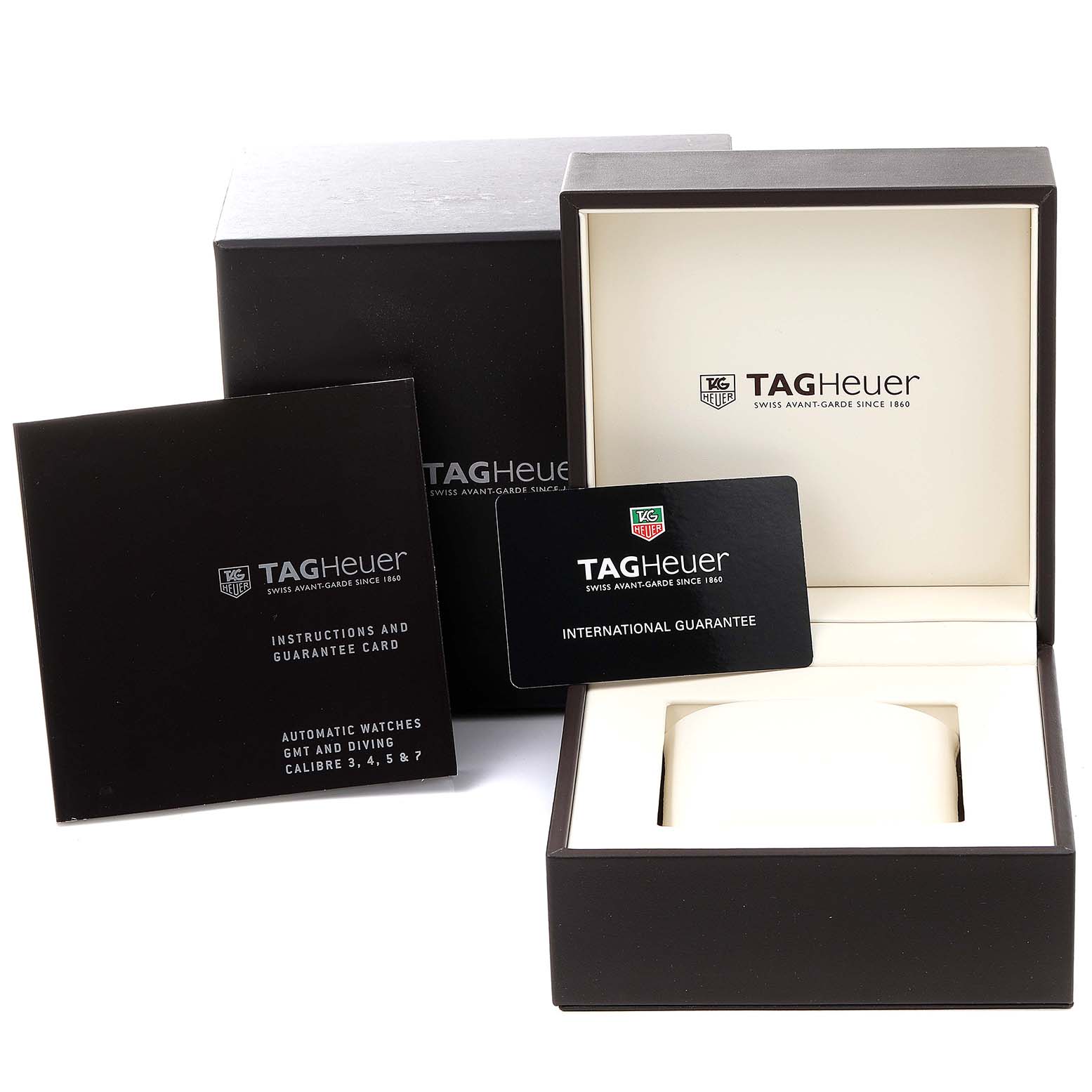 The image shows the box, instruction manual, and international guarantee card for a Tag Heuer Aquaracer WAJ2112  Men
s Stainless Steel Blue Dial WAJ2112  Men
s Stainless Steel Blue Dial watch.