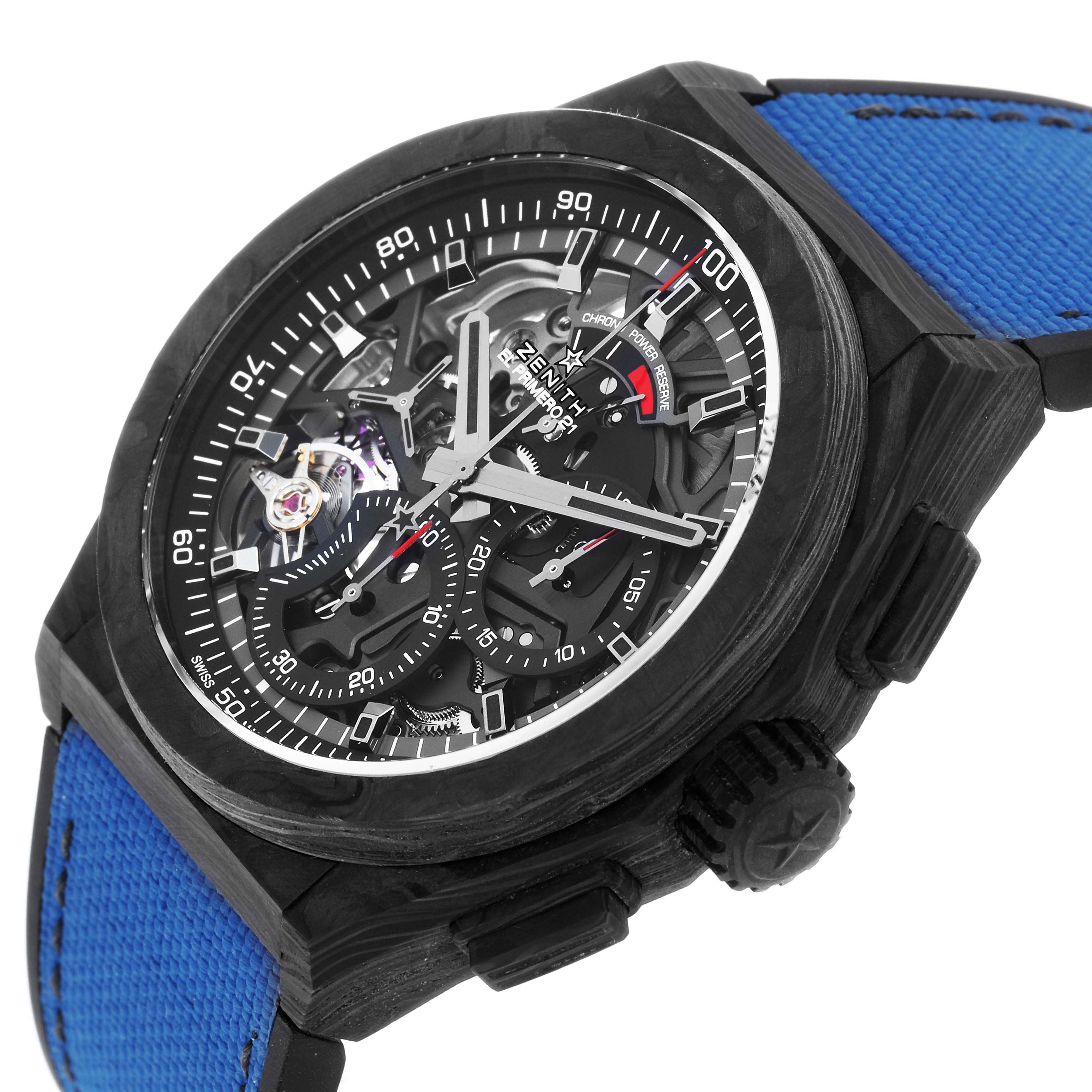 The Zenith Defy 10.9000.9004 Men's Titanium Blue Dial watch is shown from a three-quarter angle, displaying the dial, black case, blue strap, and crown.