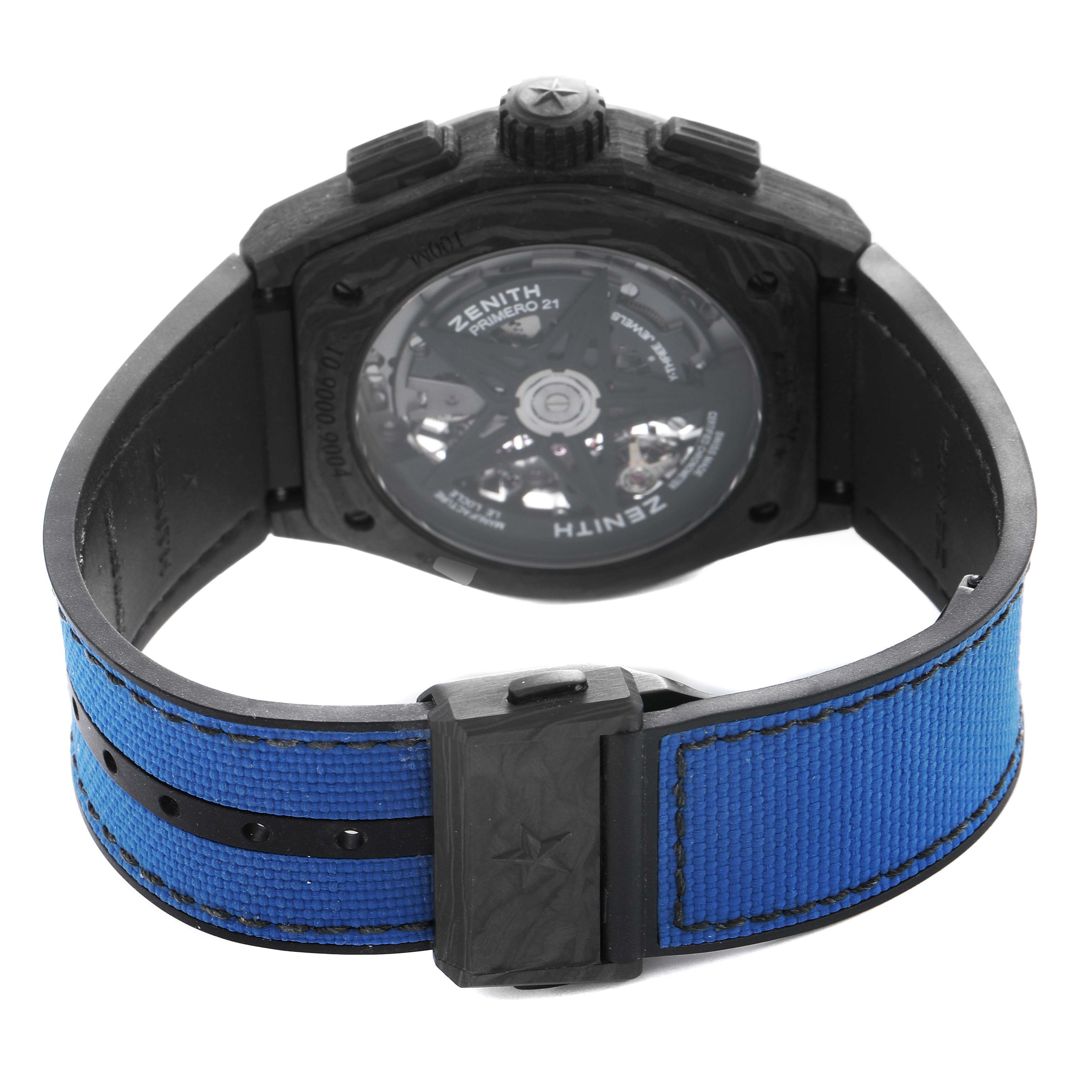 The image shows the back of a Zenith Defy 10.9000.9004 Men's Titanium Blue Dial watch, highlighting the transparent case back and blue strap.