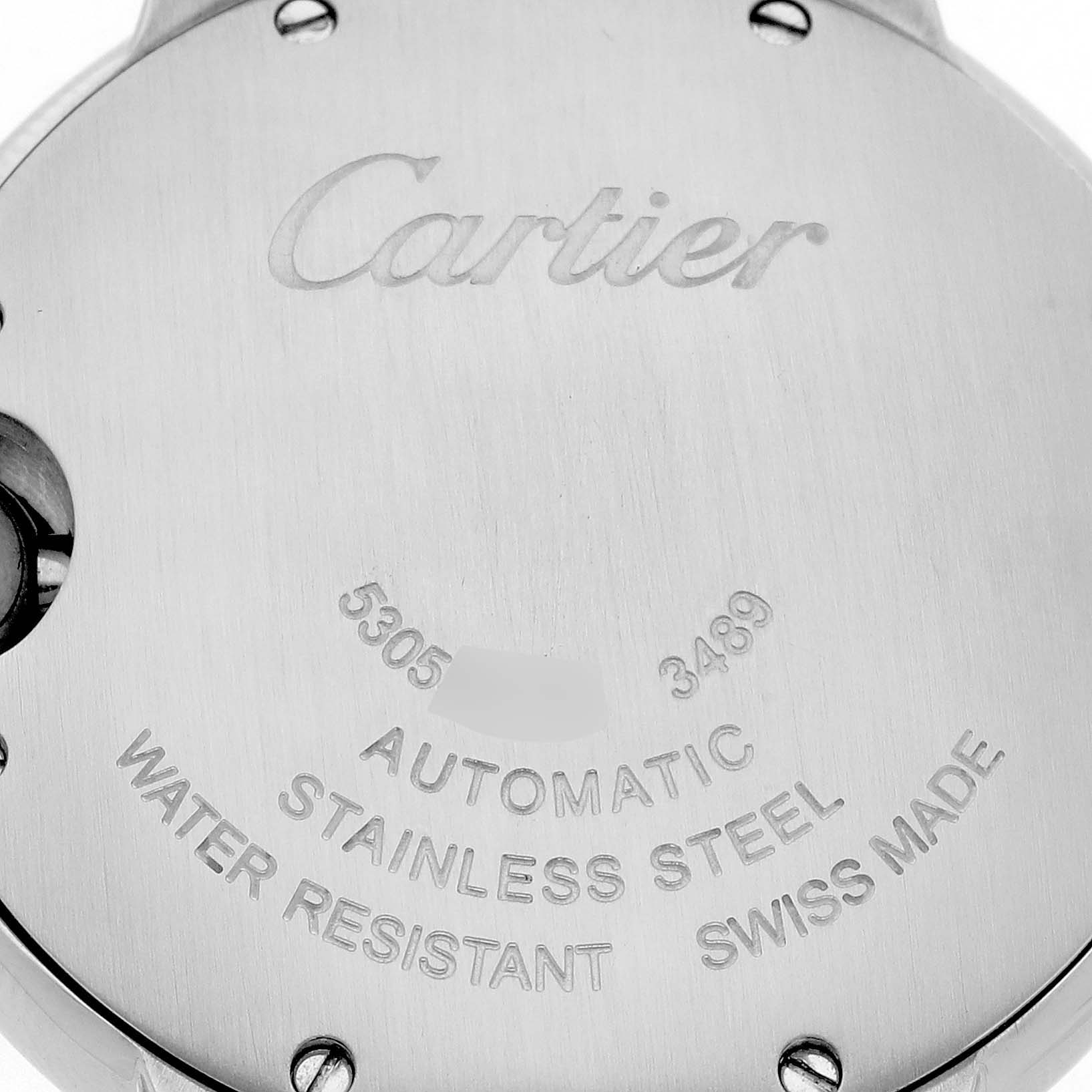 The image shows the back case of a Cartier Ballon Bleu WE902074 Women
s Stainless Steel Silver Dial WE902074 Women
s Stainless Steel Silver Dial watch, highlighting its engraving details.