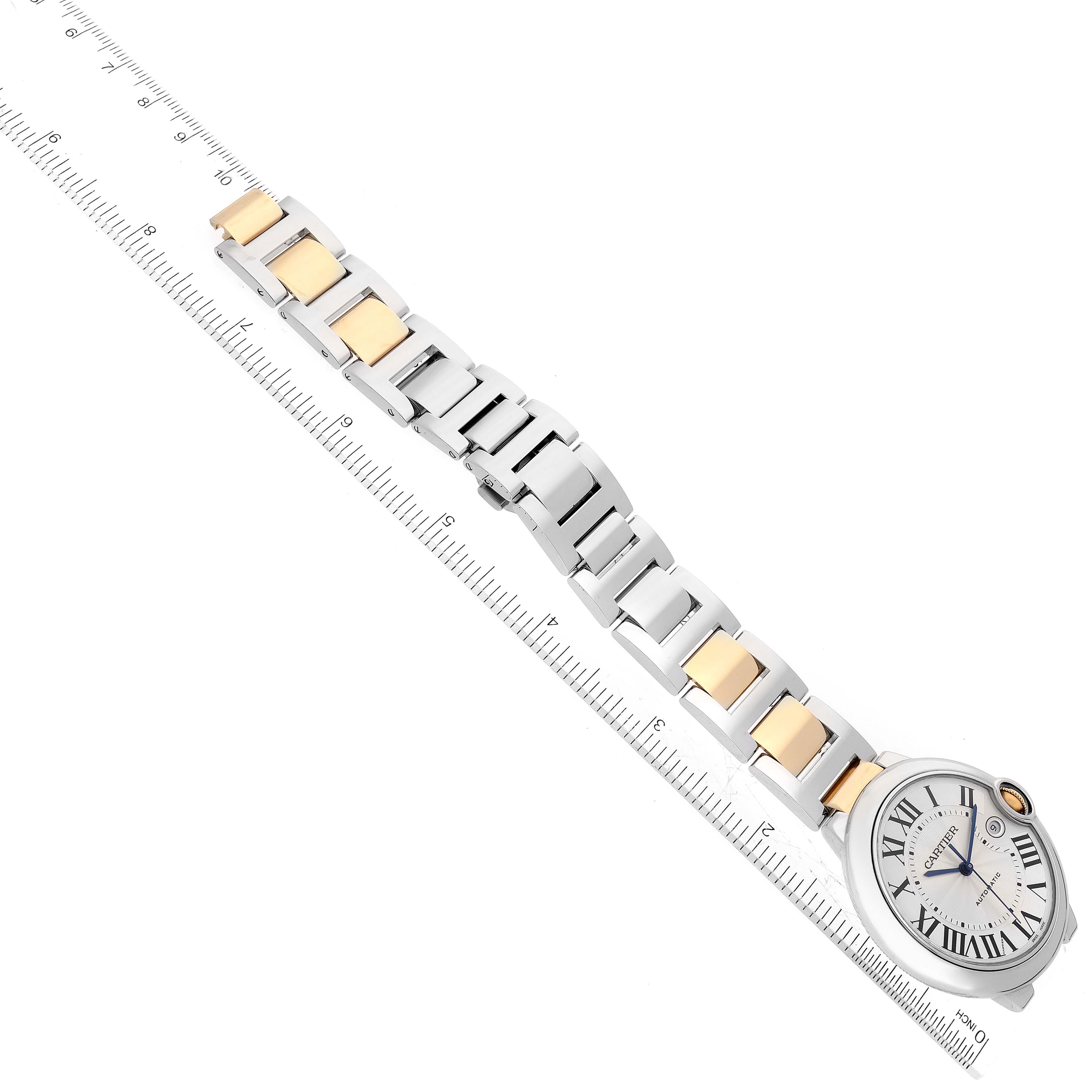 The image shows an overhead view of a Cartier Ballon Bleu W2BB0022 Men
s Stainless Steel Silver Dial W2BB0022 Men
s Stainless Steel Silver Dial watch, emphasizing its face, bezel, and two-tone metal bracelet.