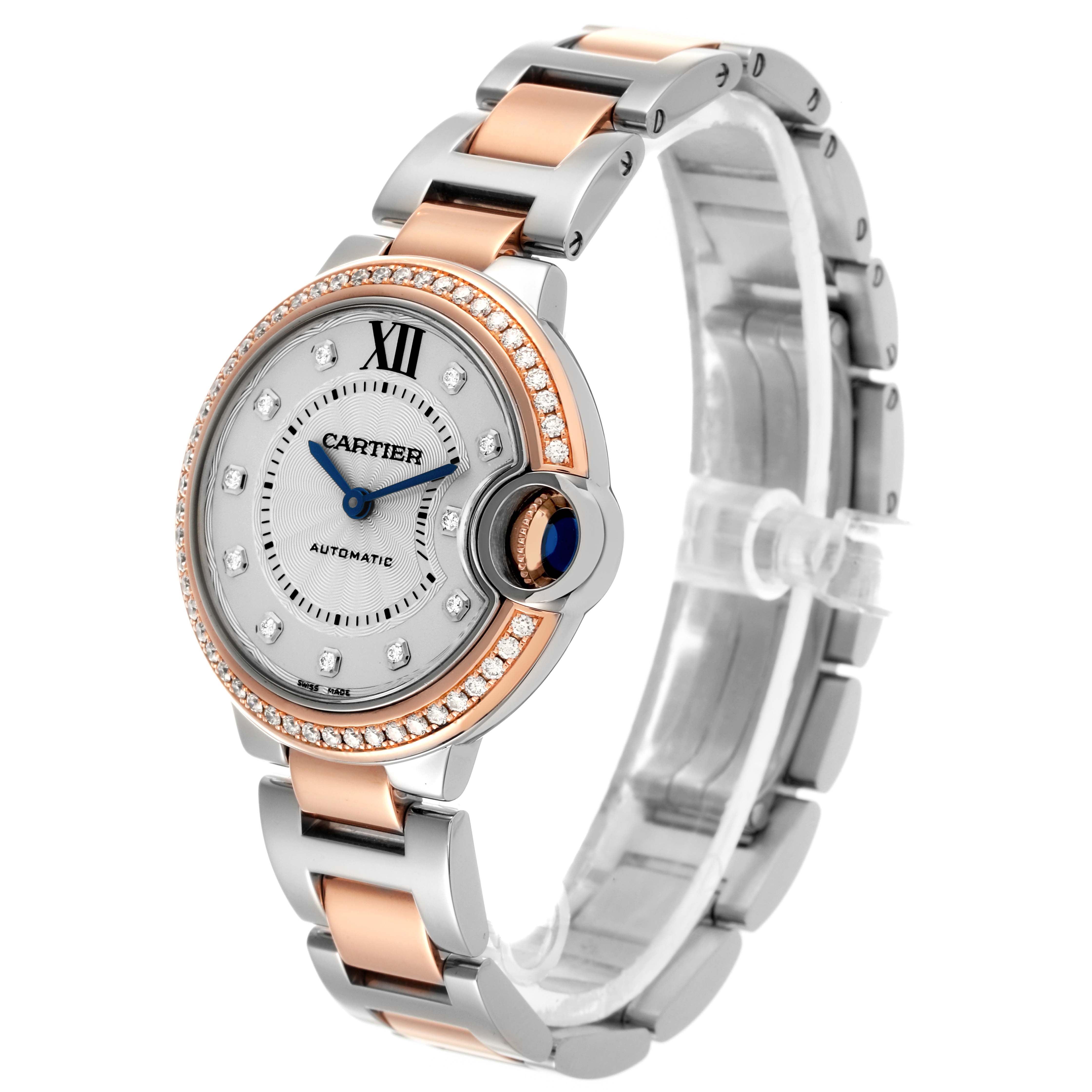 The Cartier Ballon Bleu WE902077 Women
s Steel and Gold (two tone) Silver Dial WE902077 Women
s Steel and Gold (two tone) Silver Dial watch is shown at a slight angle, highlighting the face, bezel, and bracelet.