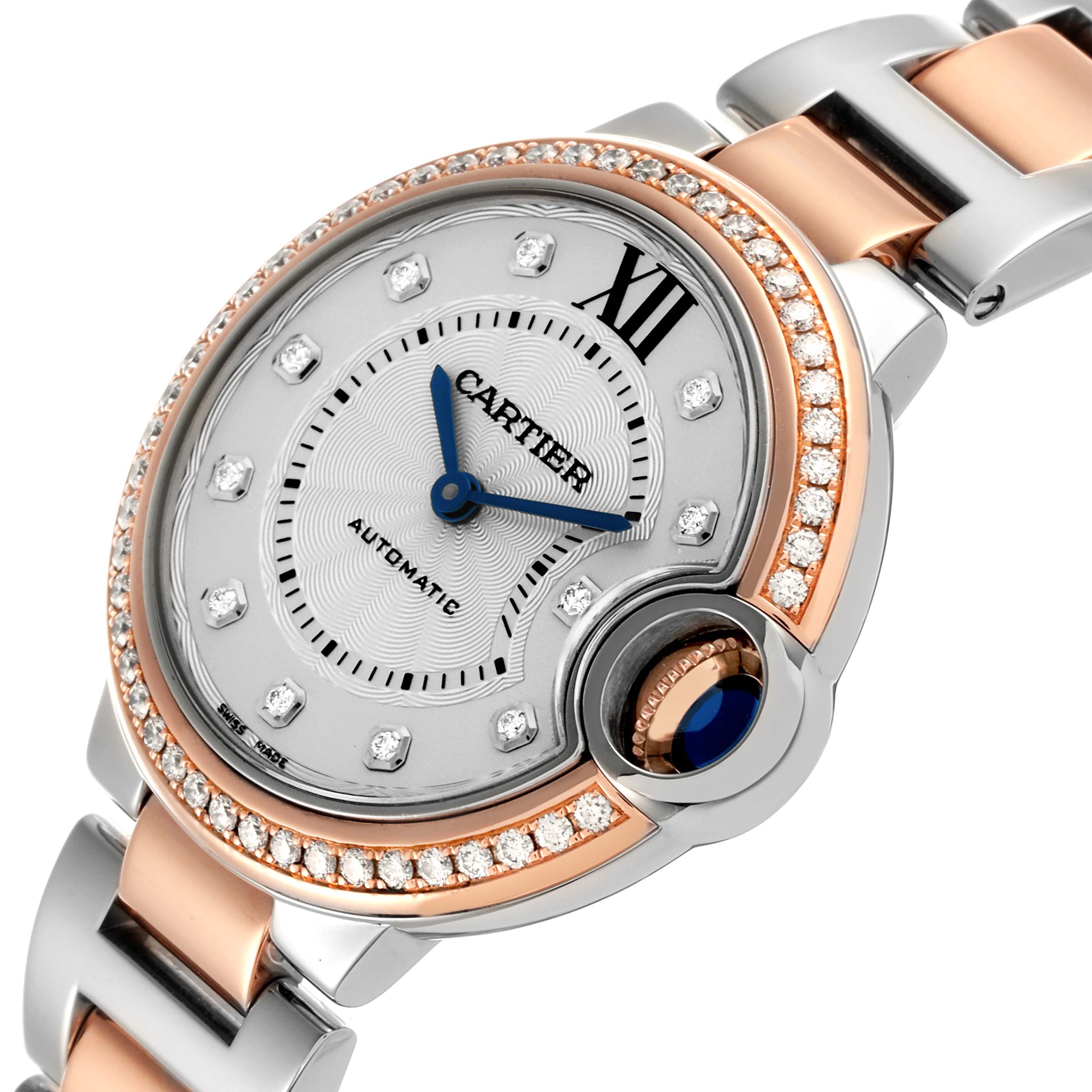 The Cartier Ballon Bleu WE902077 Women
s Steel and Gold (two tone) Silver Dial WE902077 Women
s Steel and Gold (two tone) Silver Dial watch is shown at a slight angle, highlighting the face, crown, bezel, and bracelet.