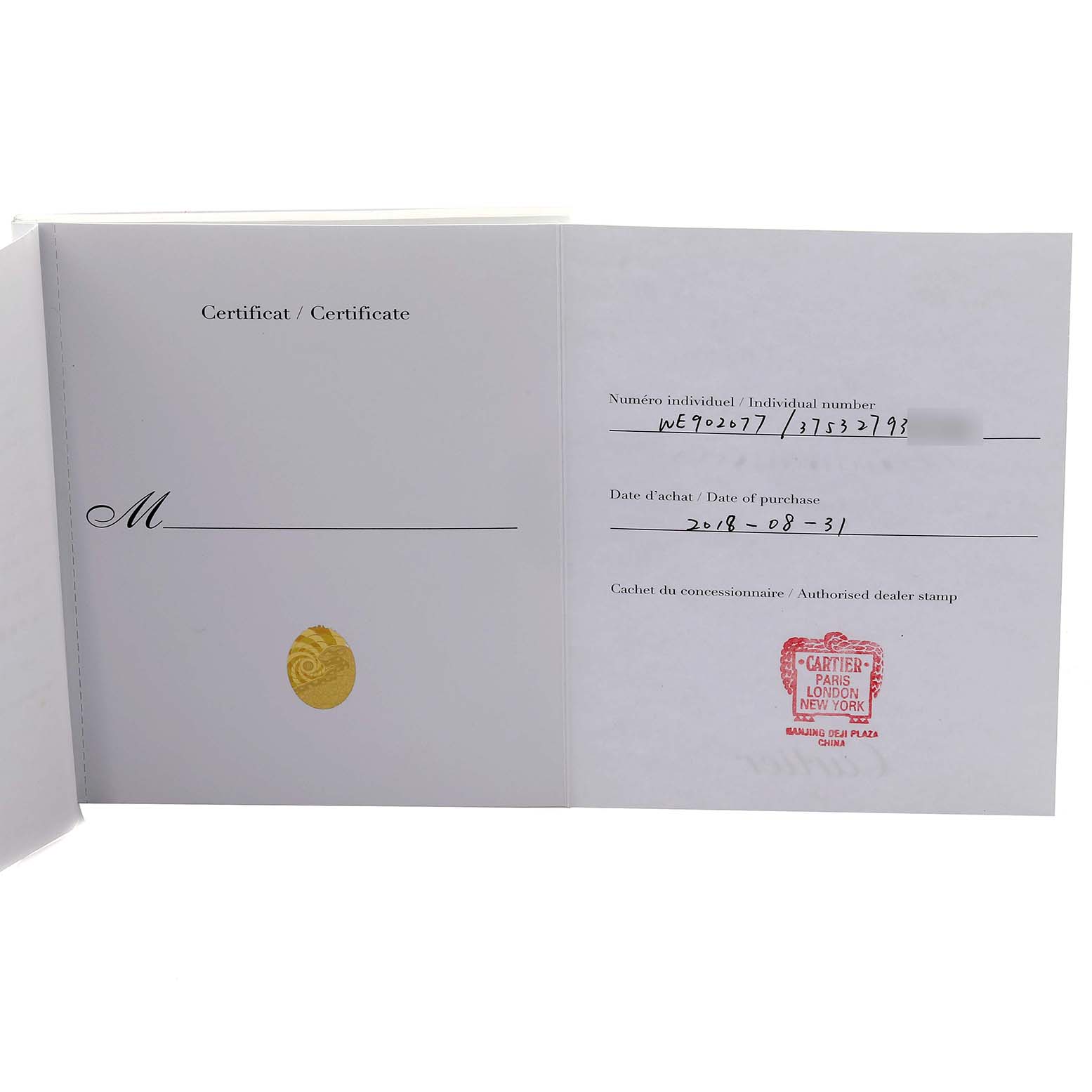 The image shows a certificate booklet for a Cartier Ballon Bleu WE902077 Women
s Steel and Gold (two tone) Silver Dial WE902077 Women
s Steel and Gold (two tone) Silver Dial watch, displaying a dealer stamp and purchase details.
