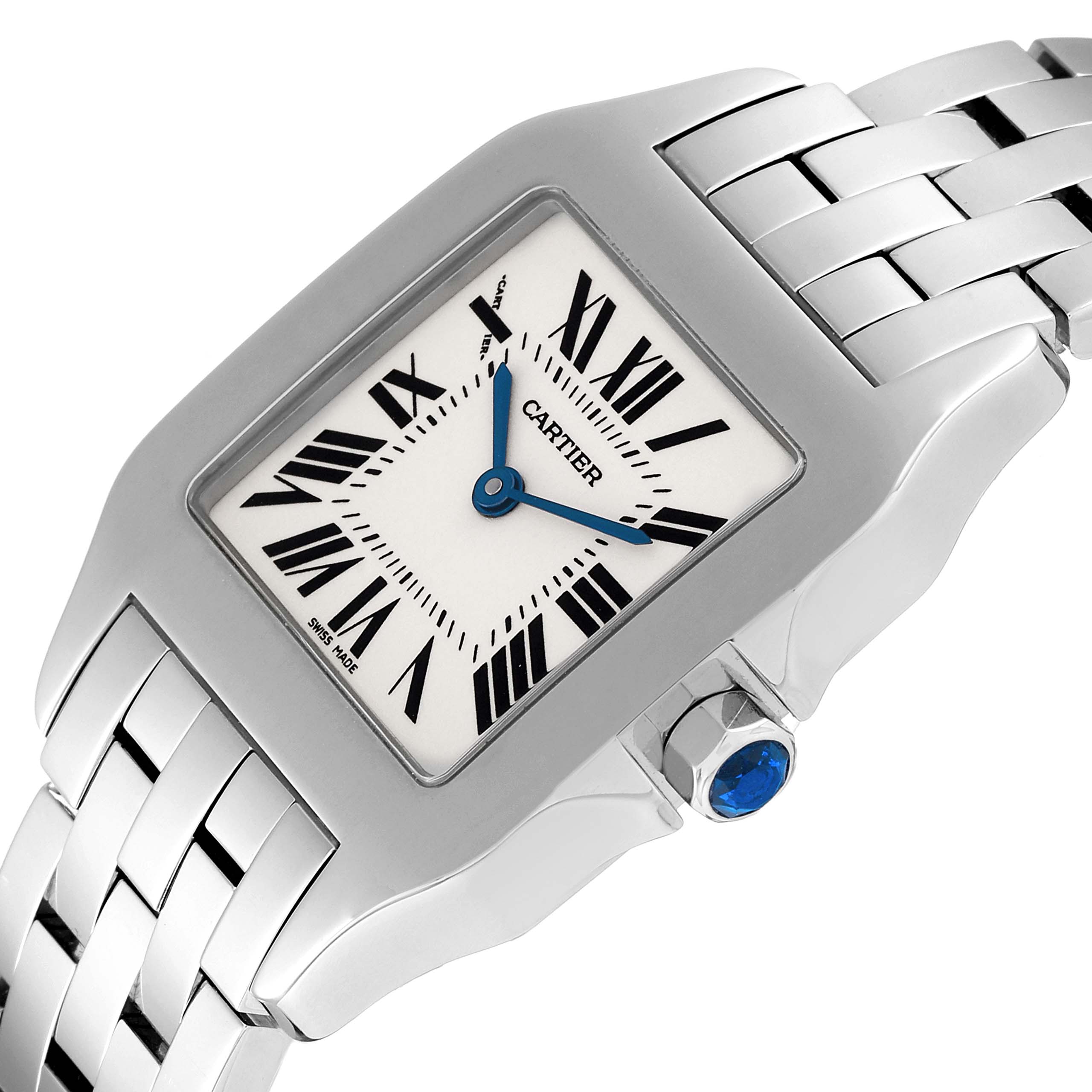 The Cartier Santos Demoiselle W25065Z5 Women
s Stainless Steel Silver Dial W25065Z5 Women
s Stainless Steel Silver Dial watch is shown at an angle highlighting the face, case, crown, and part of the bracelet.