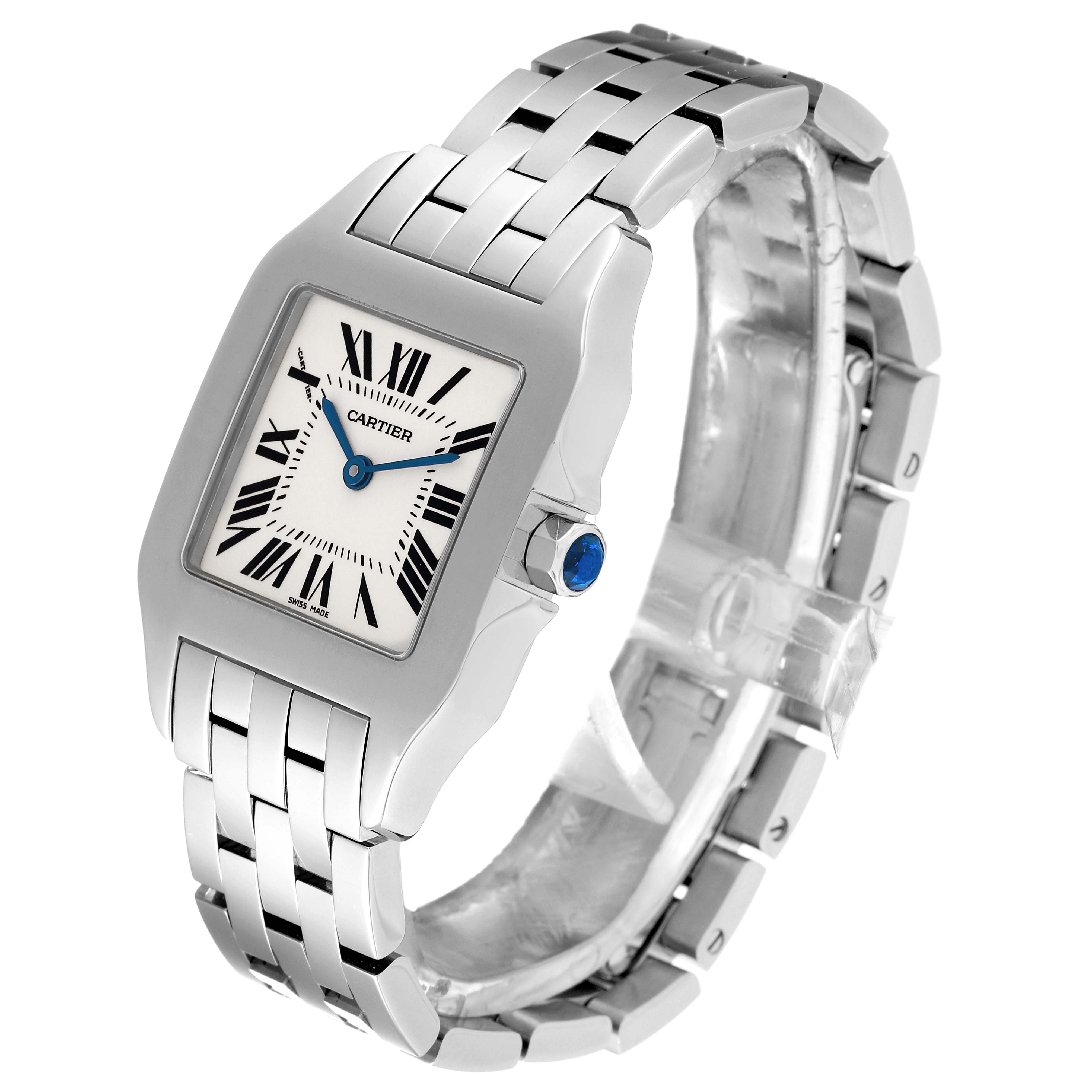 The Cartier Santos Demoiselle W25065Z5 Women
s Stainless Steel Silver Dial W25065Z5 Women
s Stainless Steel Silver Dial watch is shown at a three-quarter angle, highlighting its face, strap, and crown.